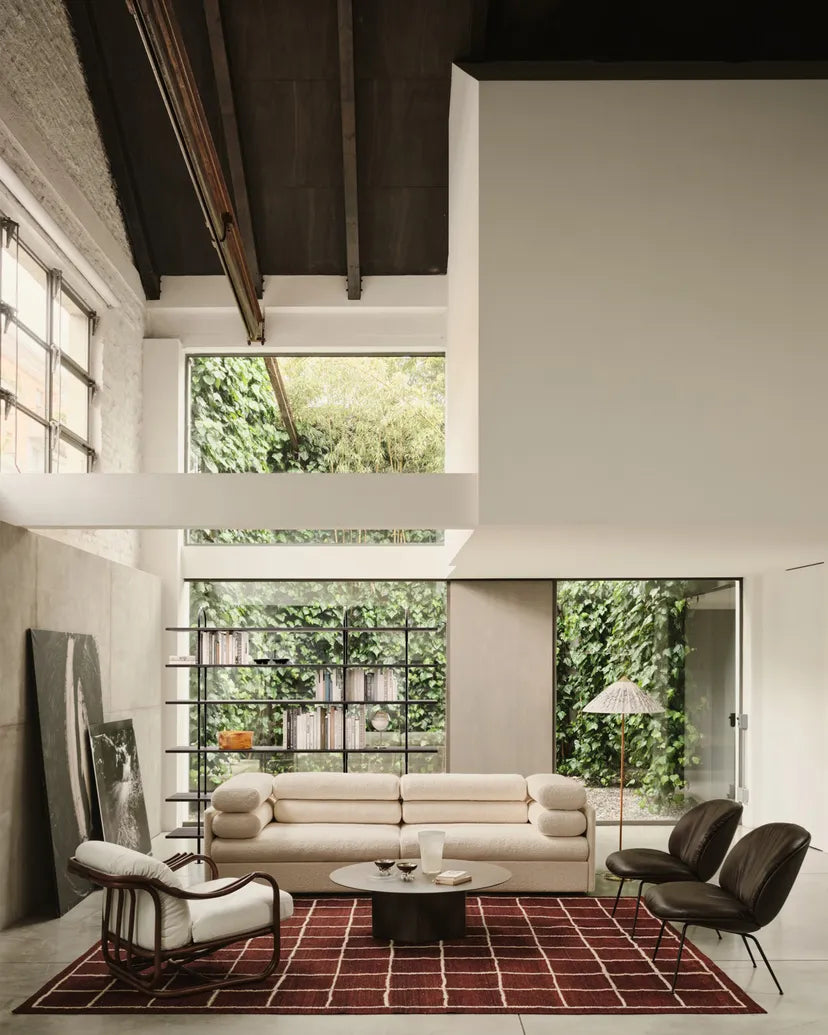 BEETLE SOFT upholstered armchair with a black base