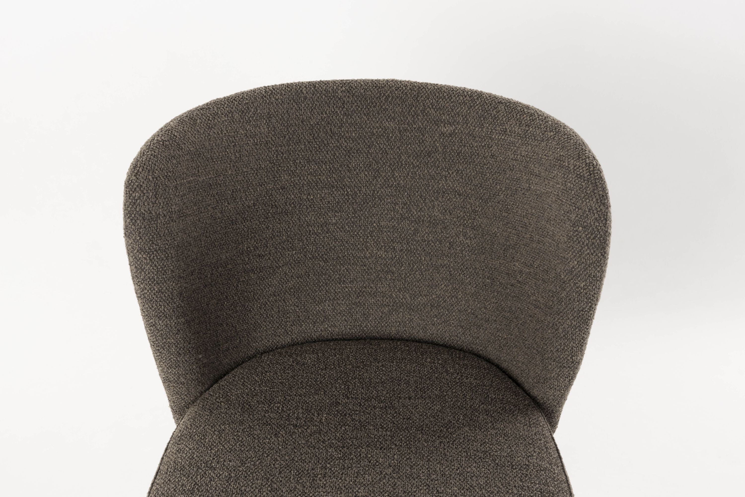 Brown guus chair with a black base