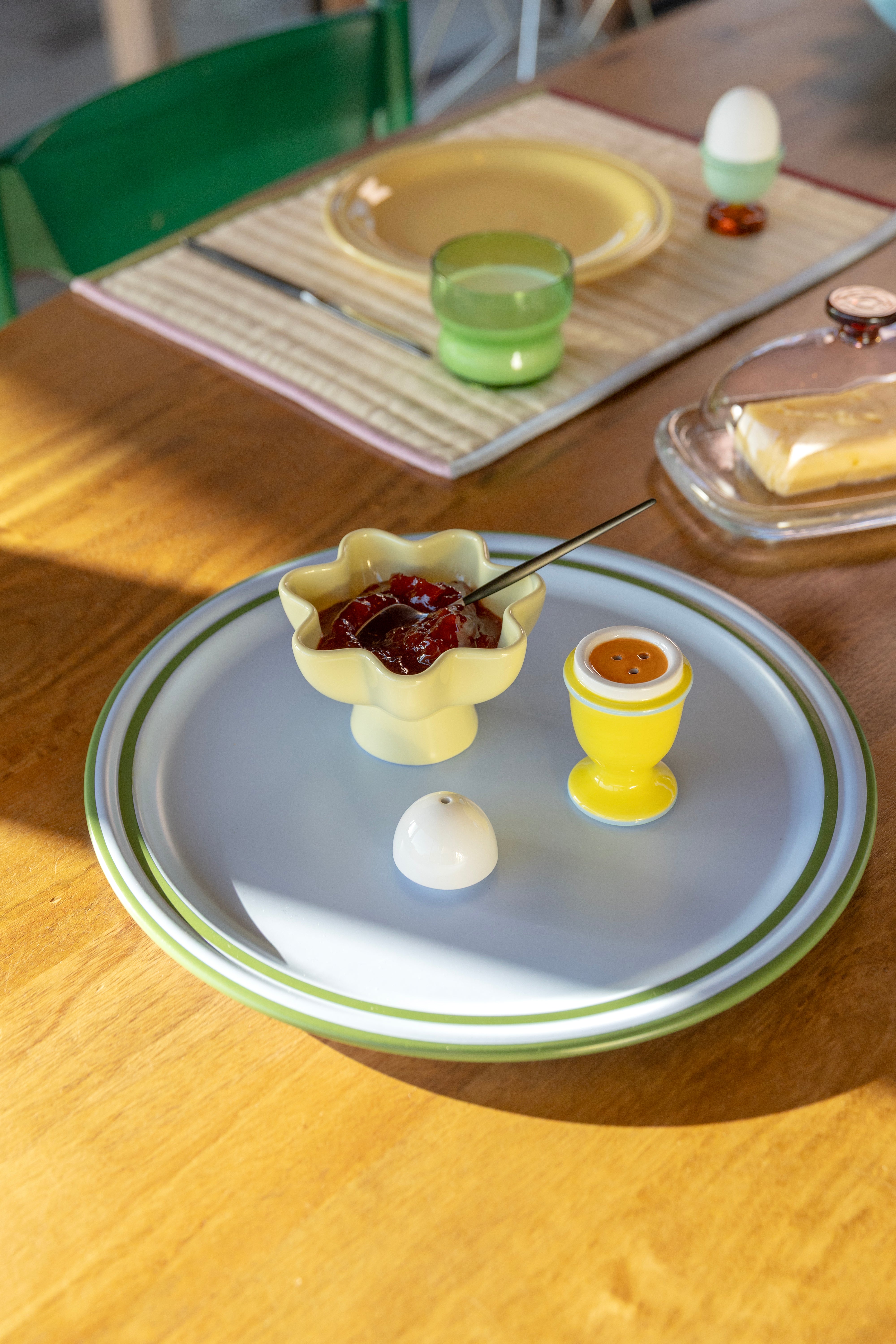 Egg-shaped salt and pepper shakers in yellow with blue and white