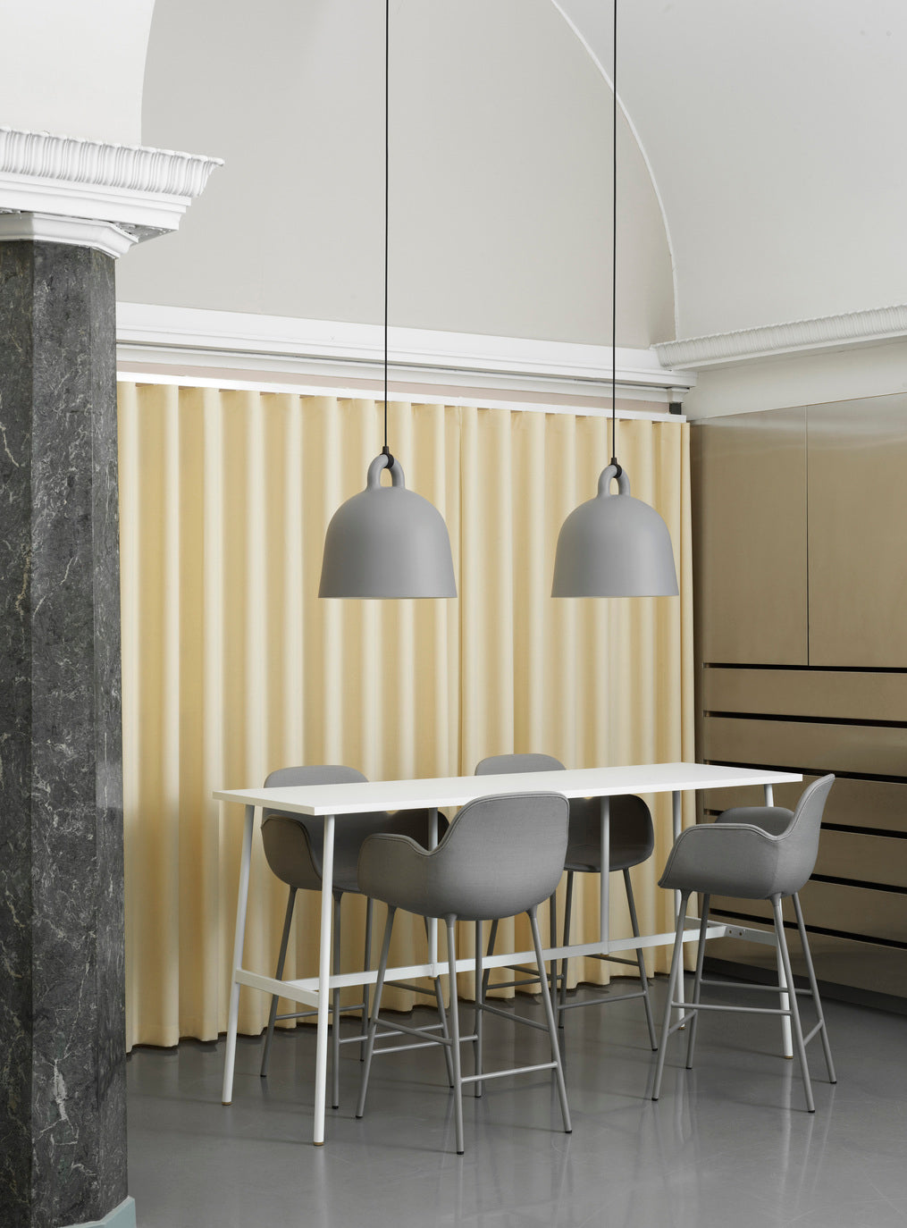 Bar chair upholstered with armrests of forms with a gray base