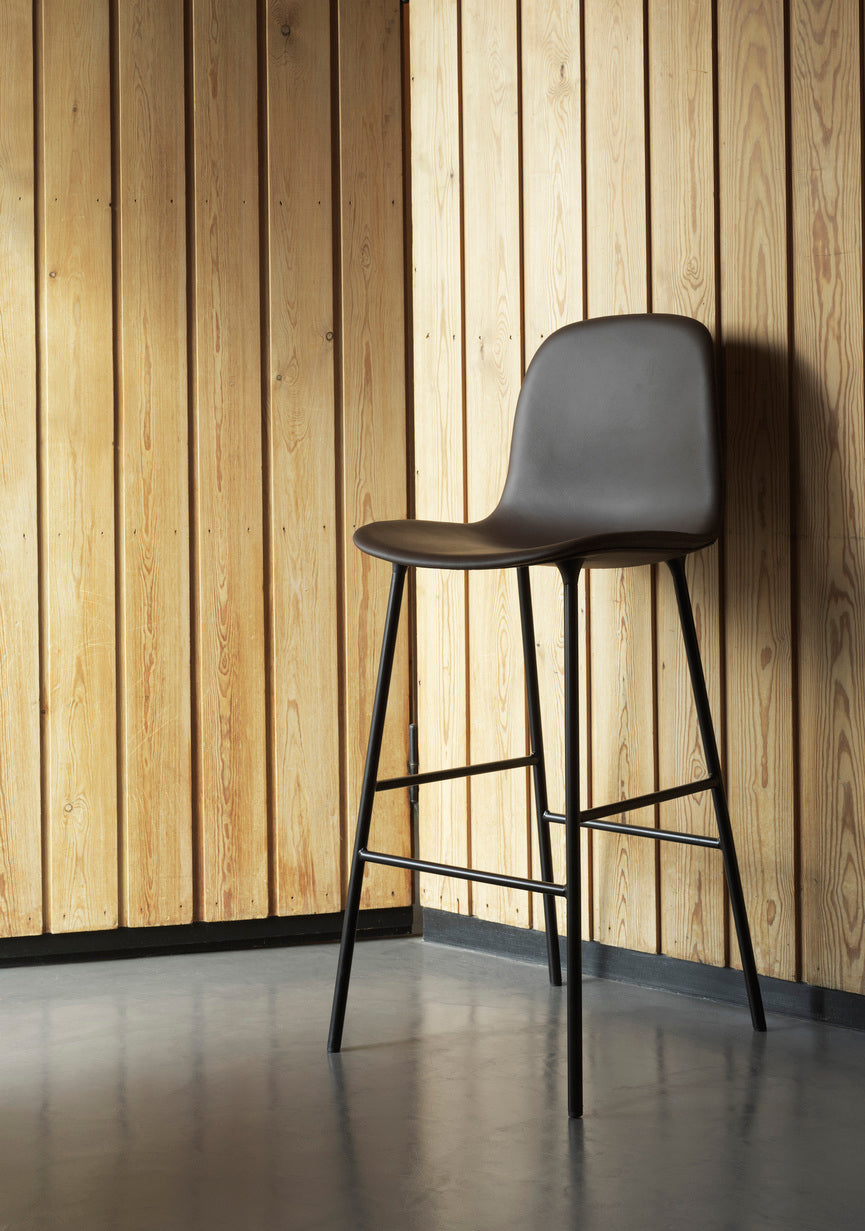 Bar chair upholstered forms with a brown base