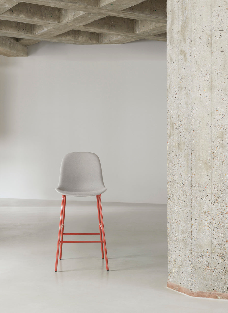 Bar chair upholstered forms with a light gray base