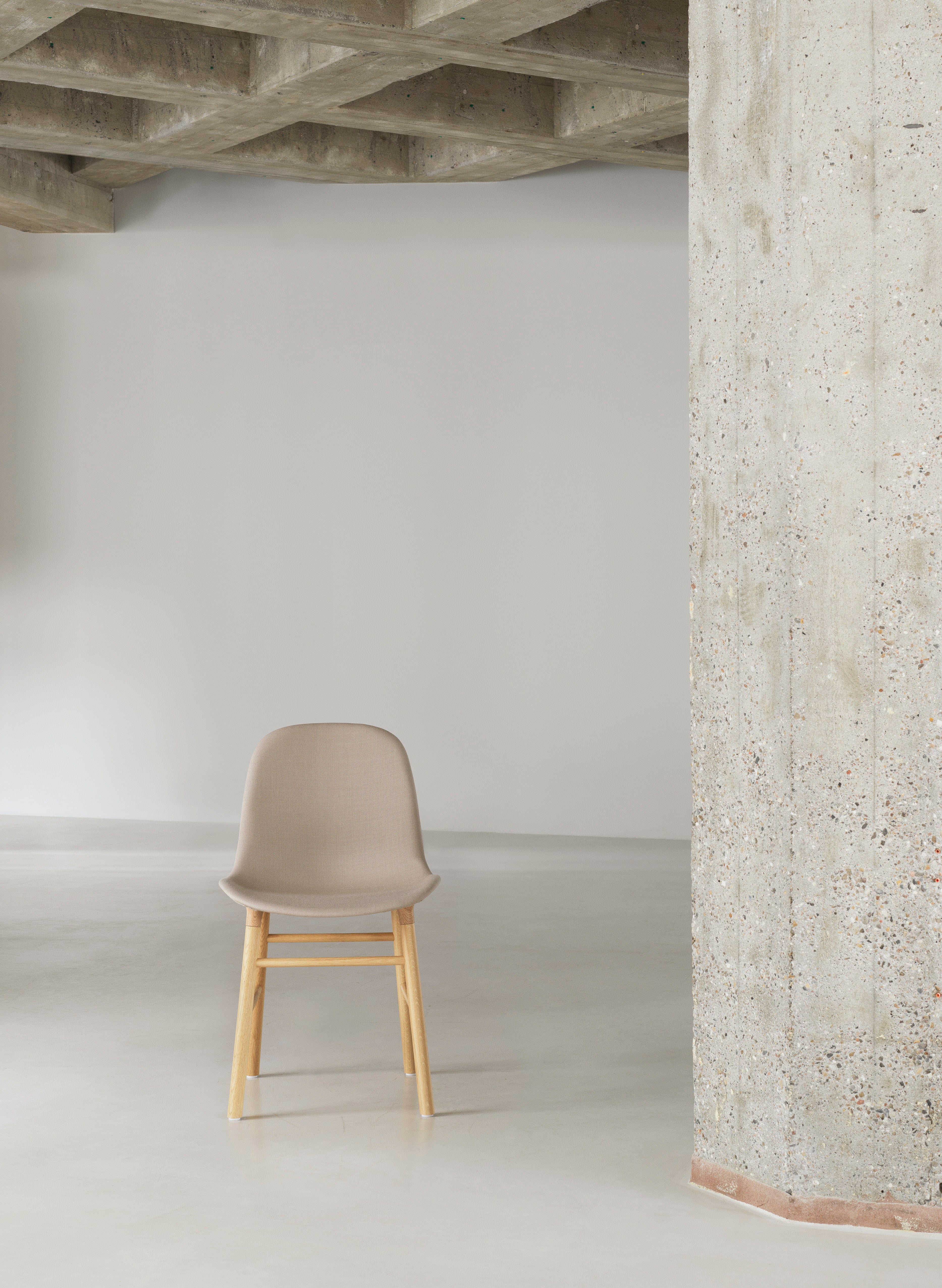 Upholstered chair forms with an oak base