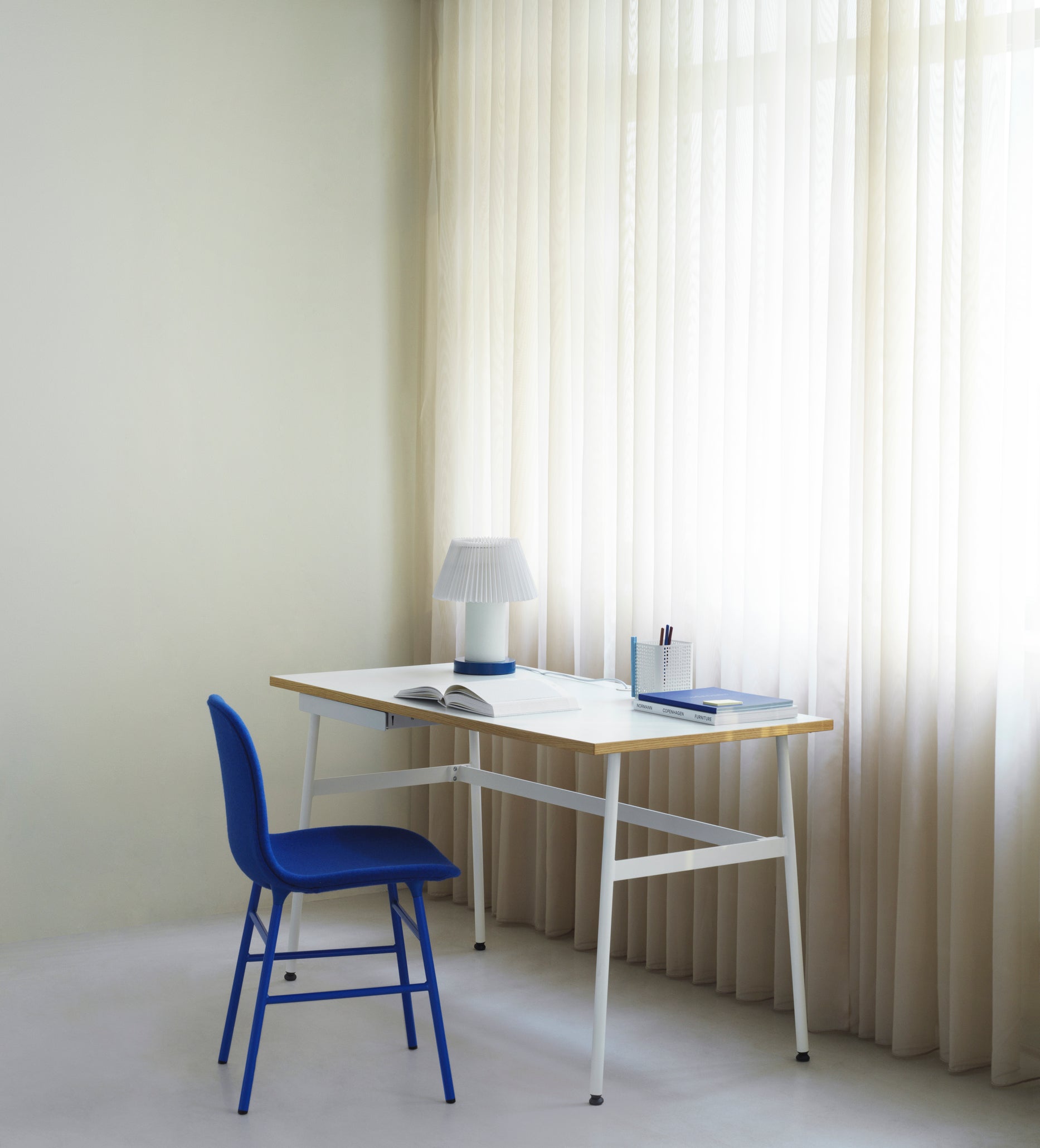 A chair upholstered forms with a brown base
