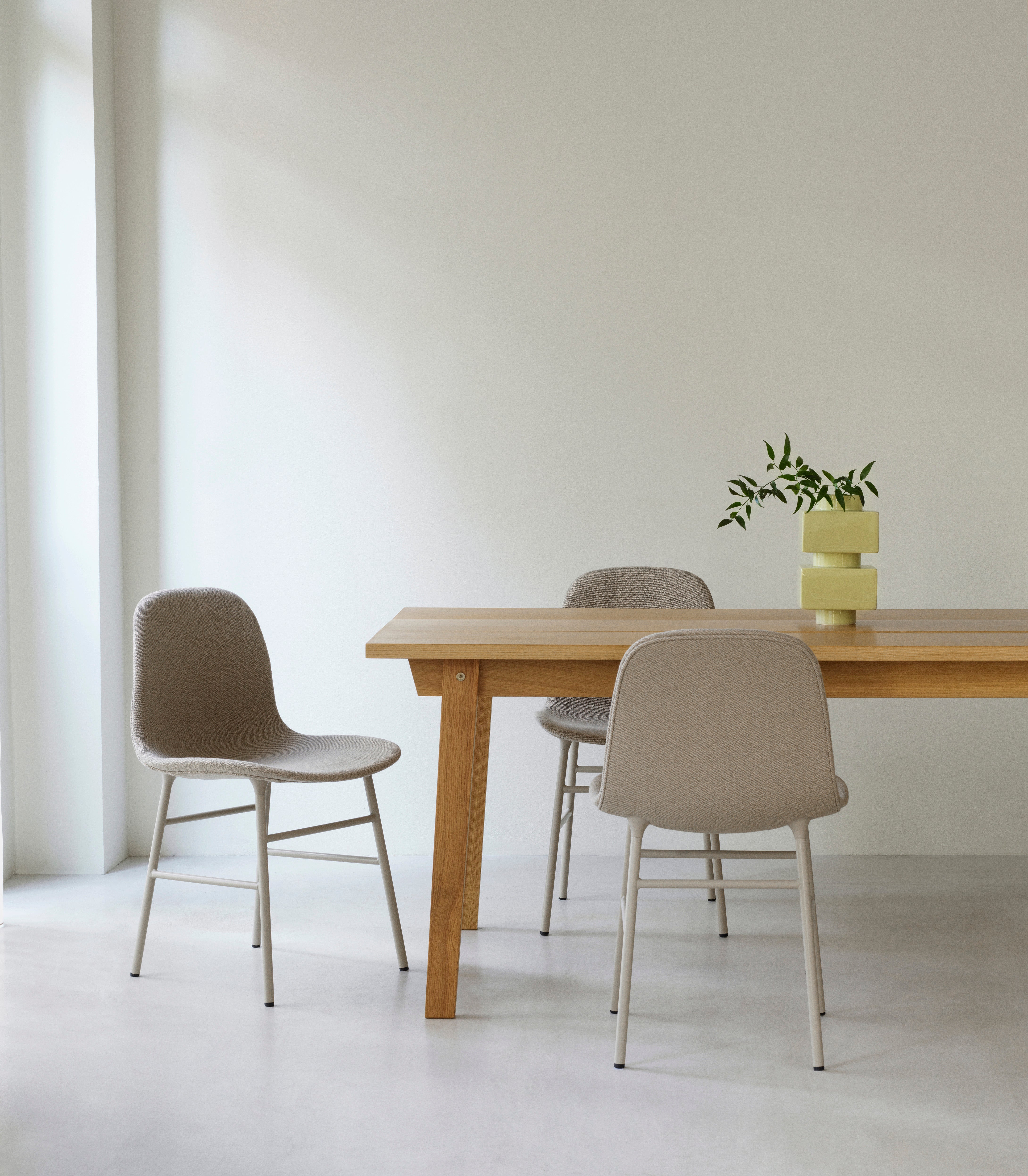Upholstered chair forms with a red base
