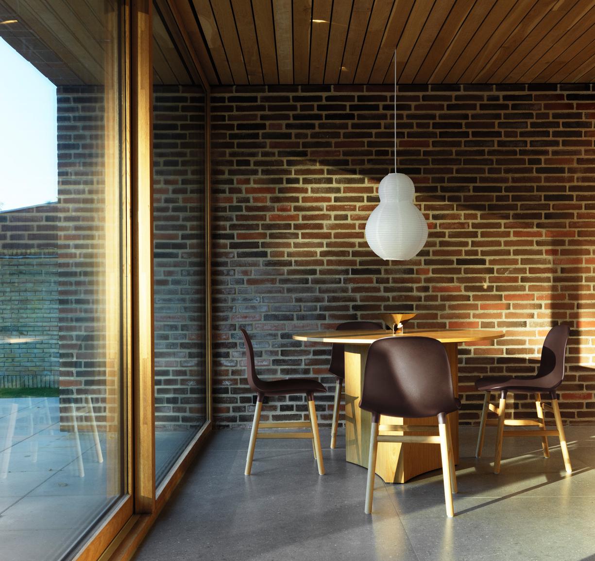 Red forms chair with an oak base