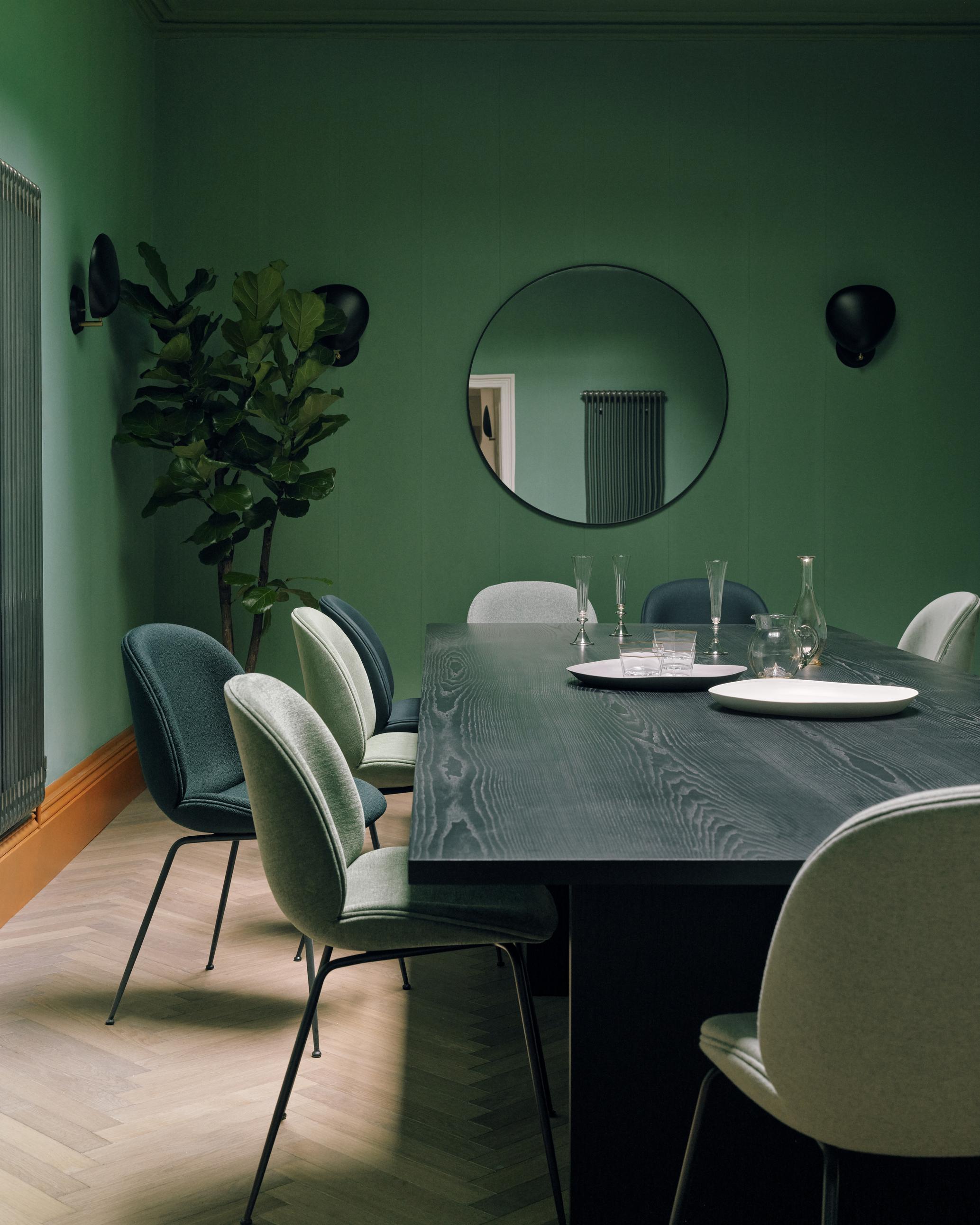 BEETLE upholstered chair with a black steel base