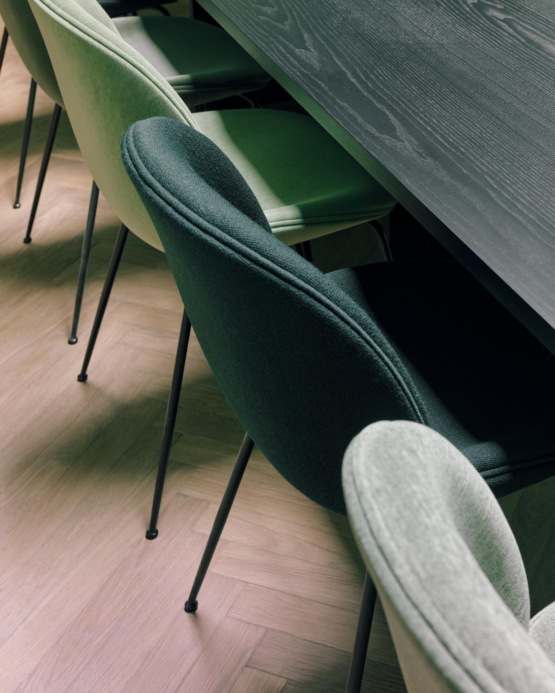 BEETLE upholstered chair with a black steel base