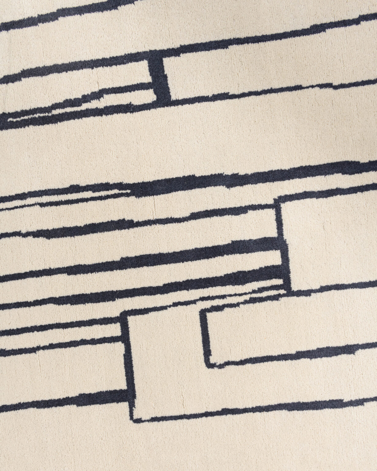 Asymetrická dekorativní koberec CONTOUR šedobéžový s černou