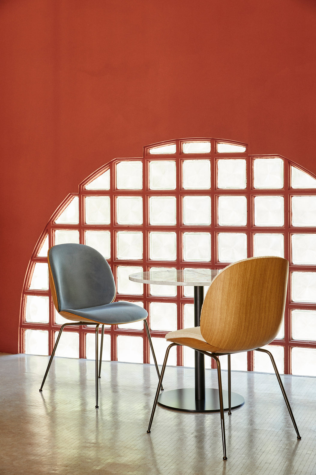 BEETLE upholstered chair with a black steel base