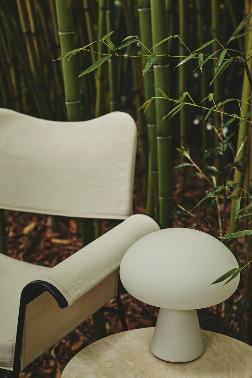 TROPIQUE cream garden chair with a white steel base