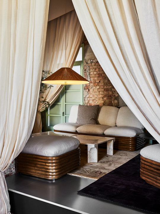 Bohemian Puff 72 upholstered with a rattan base