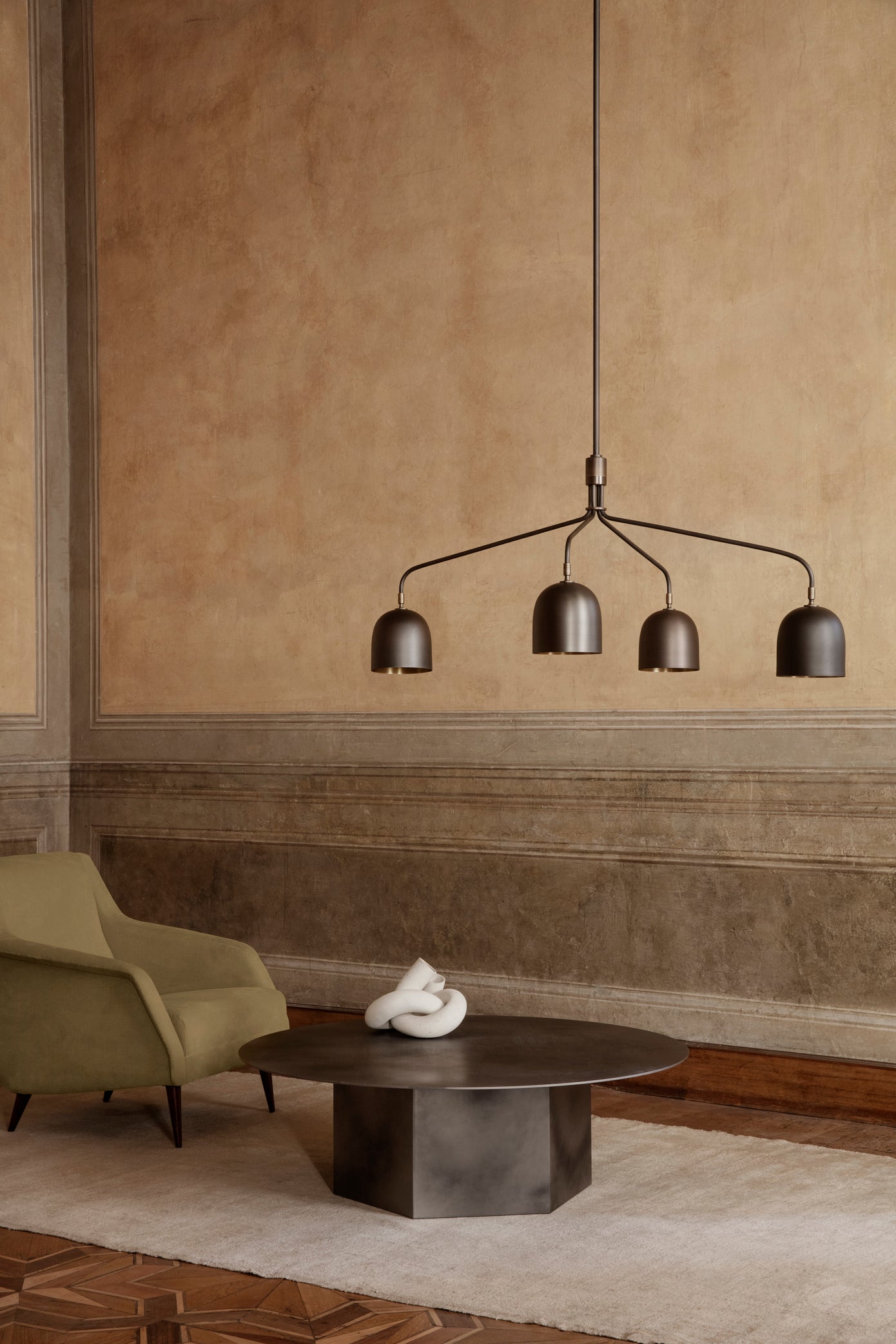 CDC.1 upholstered armchair with a brass base