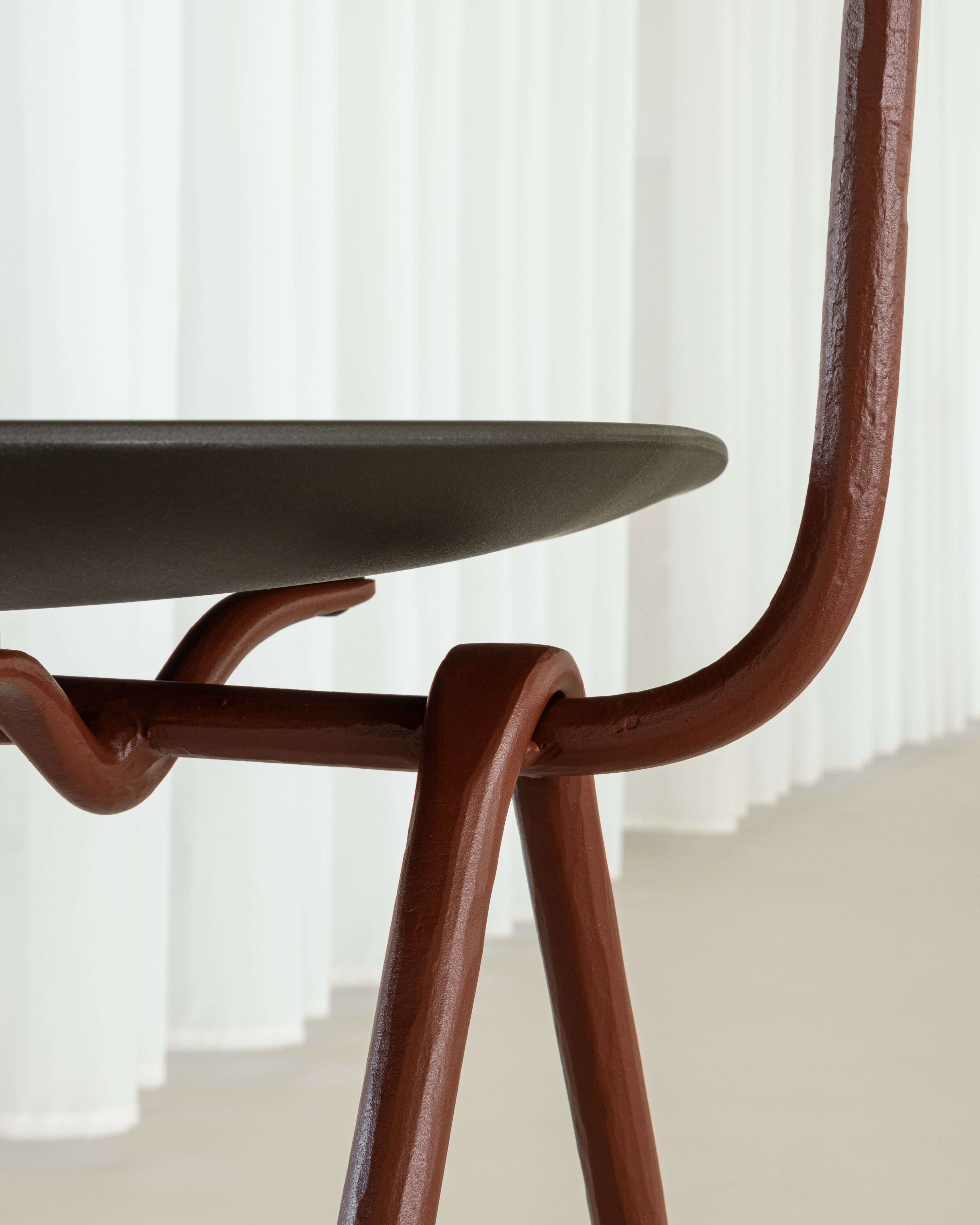 OFFICINA chair with a brown base and dark green seat