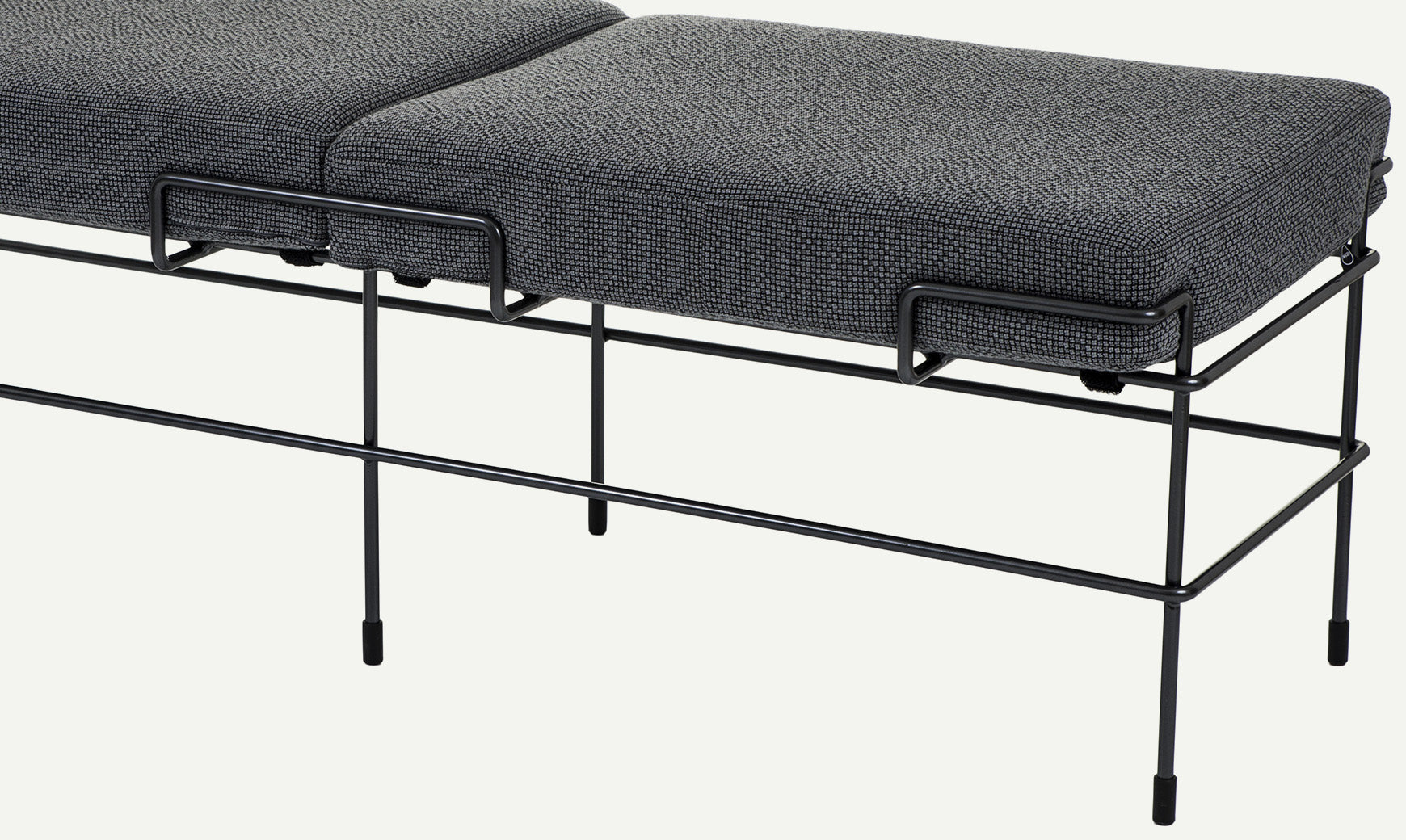 TRAFFIC upholstered bench with a black steel base