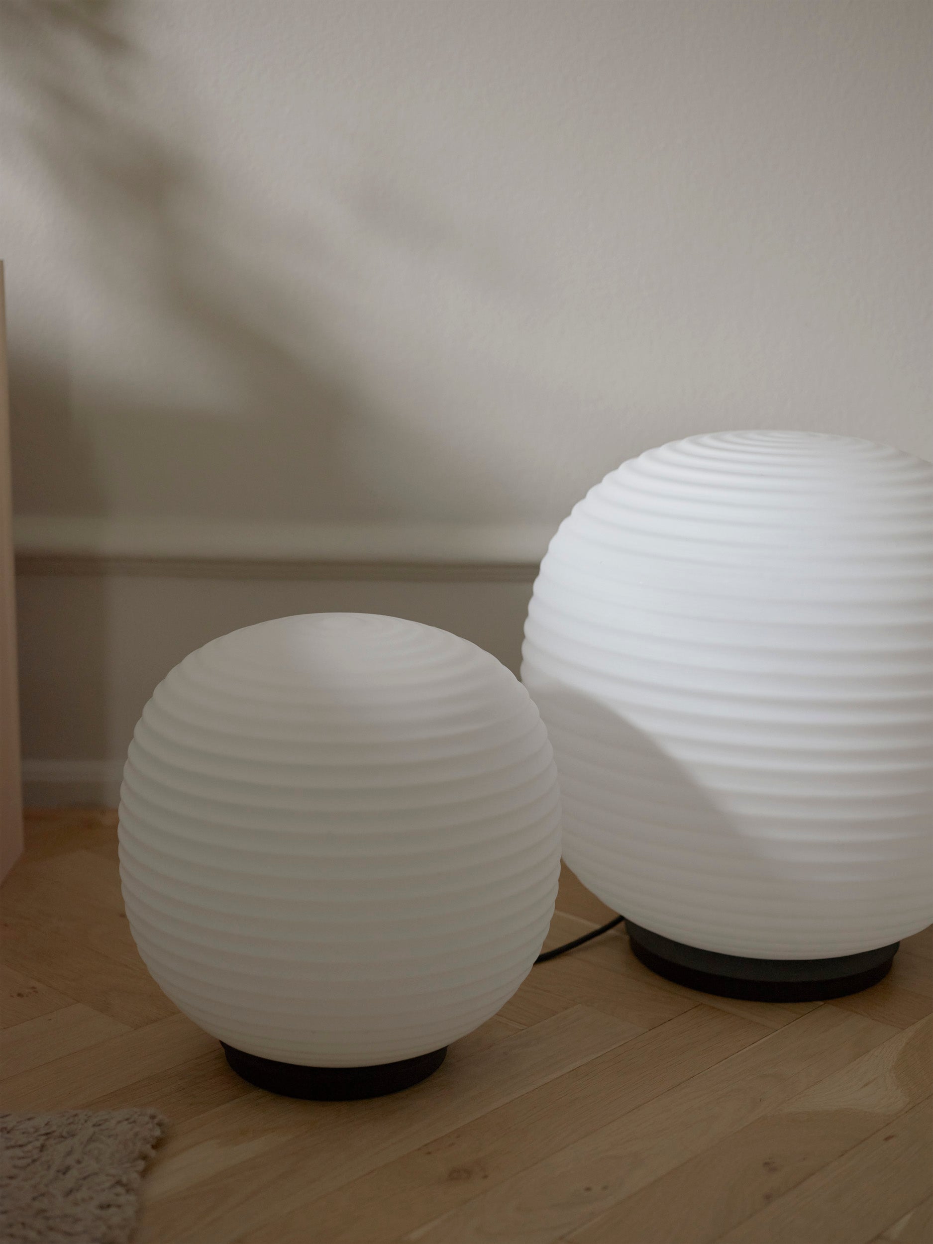 Lantern Globe white table lamp with a black base