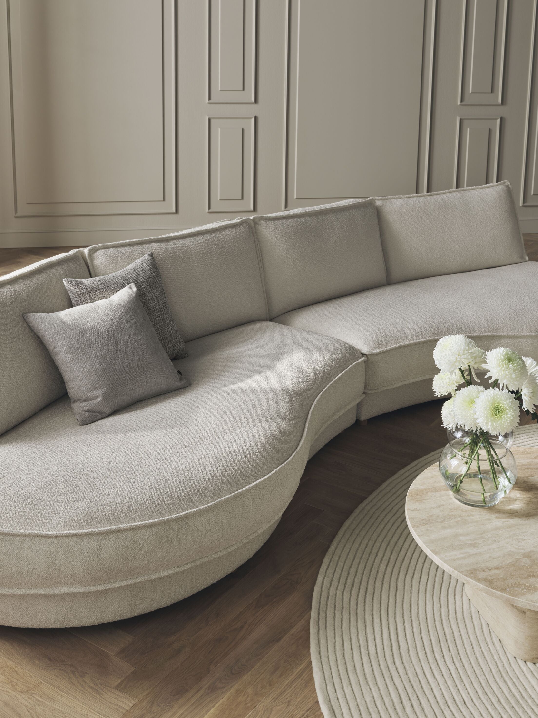 NOORA modular sofa - a rounded left -hand module with a black base