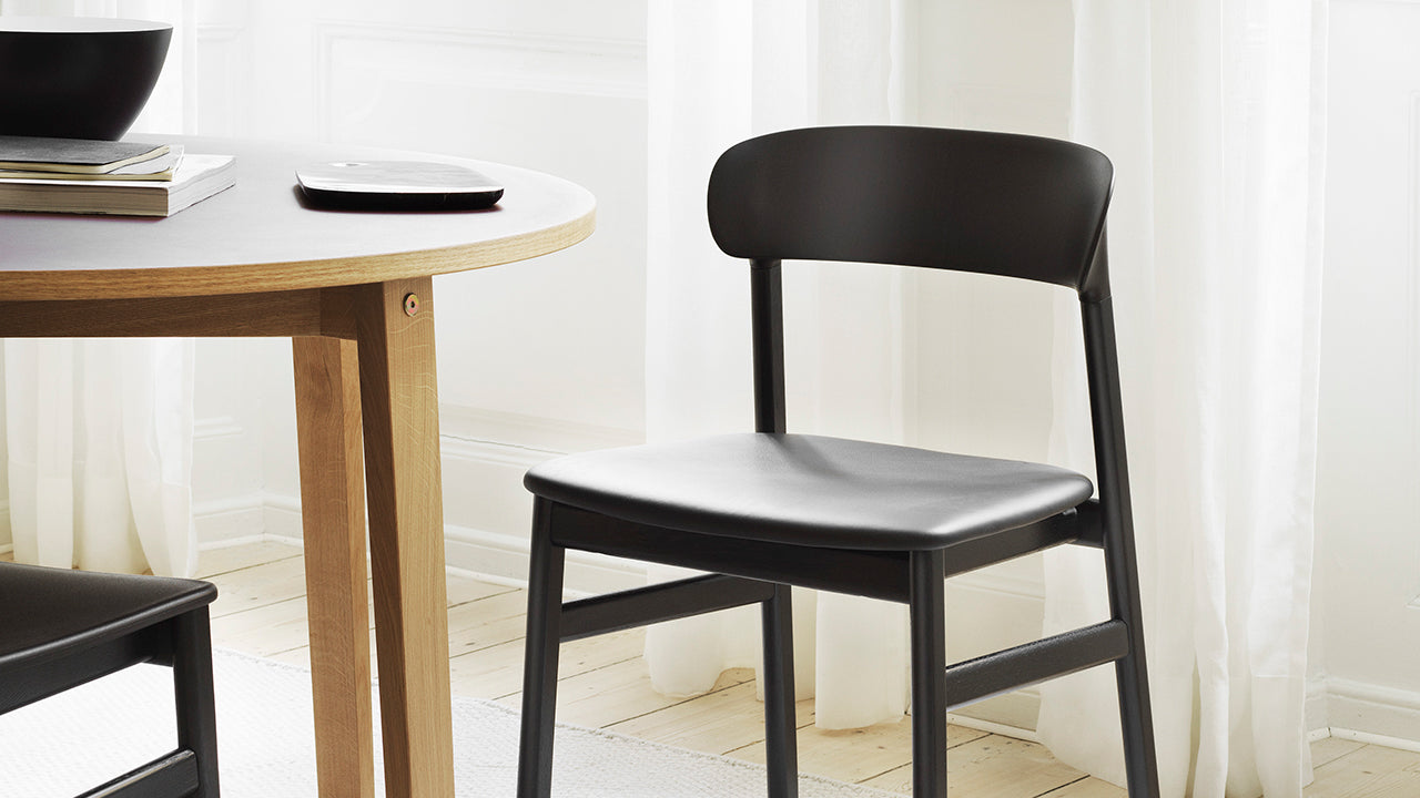 Herit black chair with a black oak base
