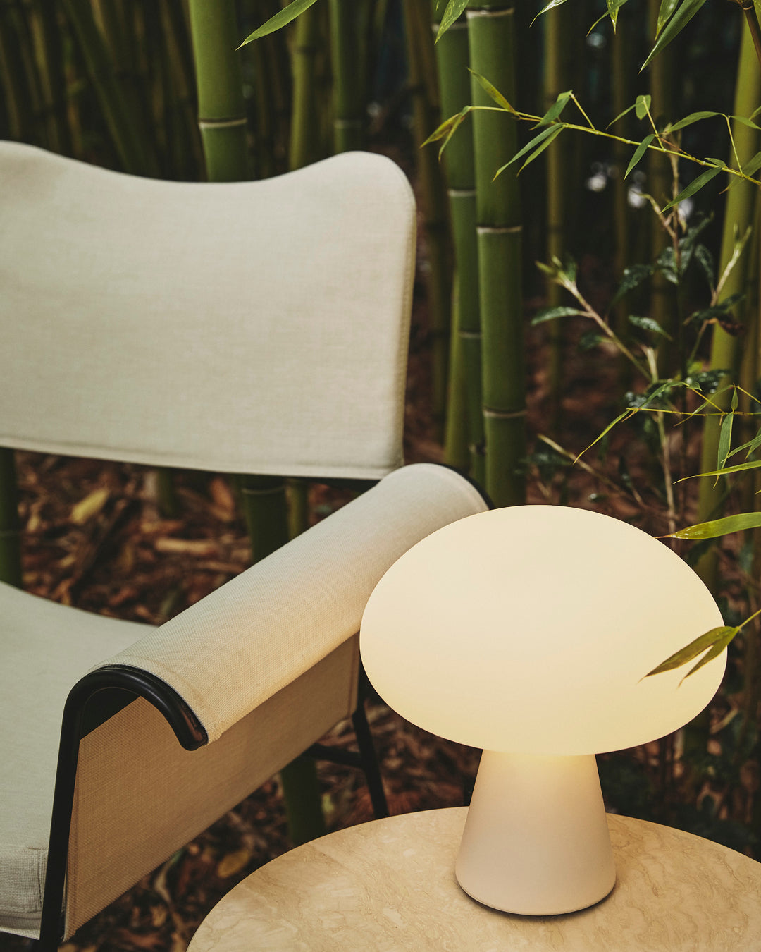 TROPIQUE cream garden chair with a white steel base