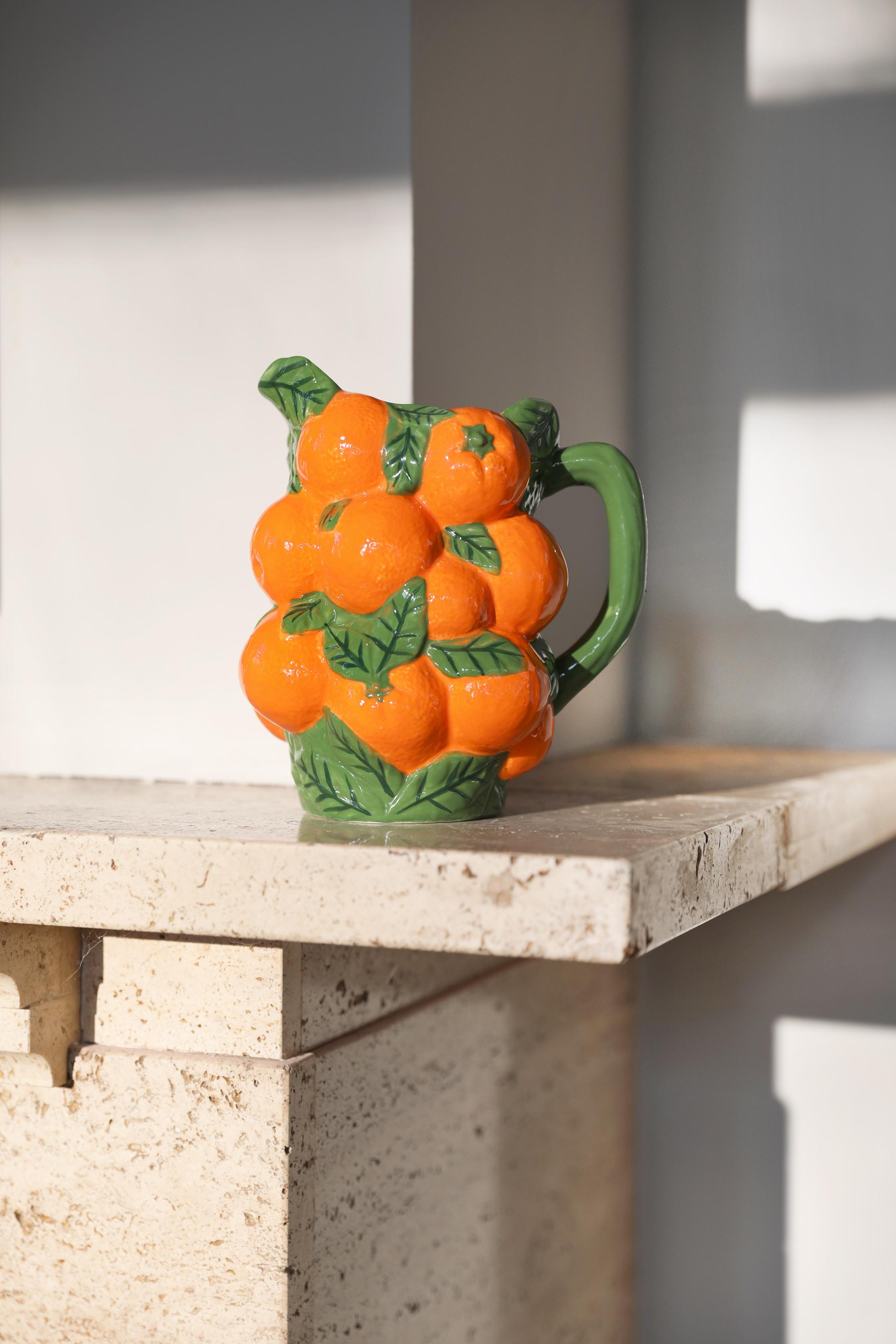 Orange pitcher with green