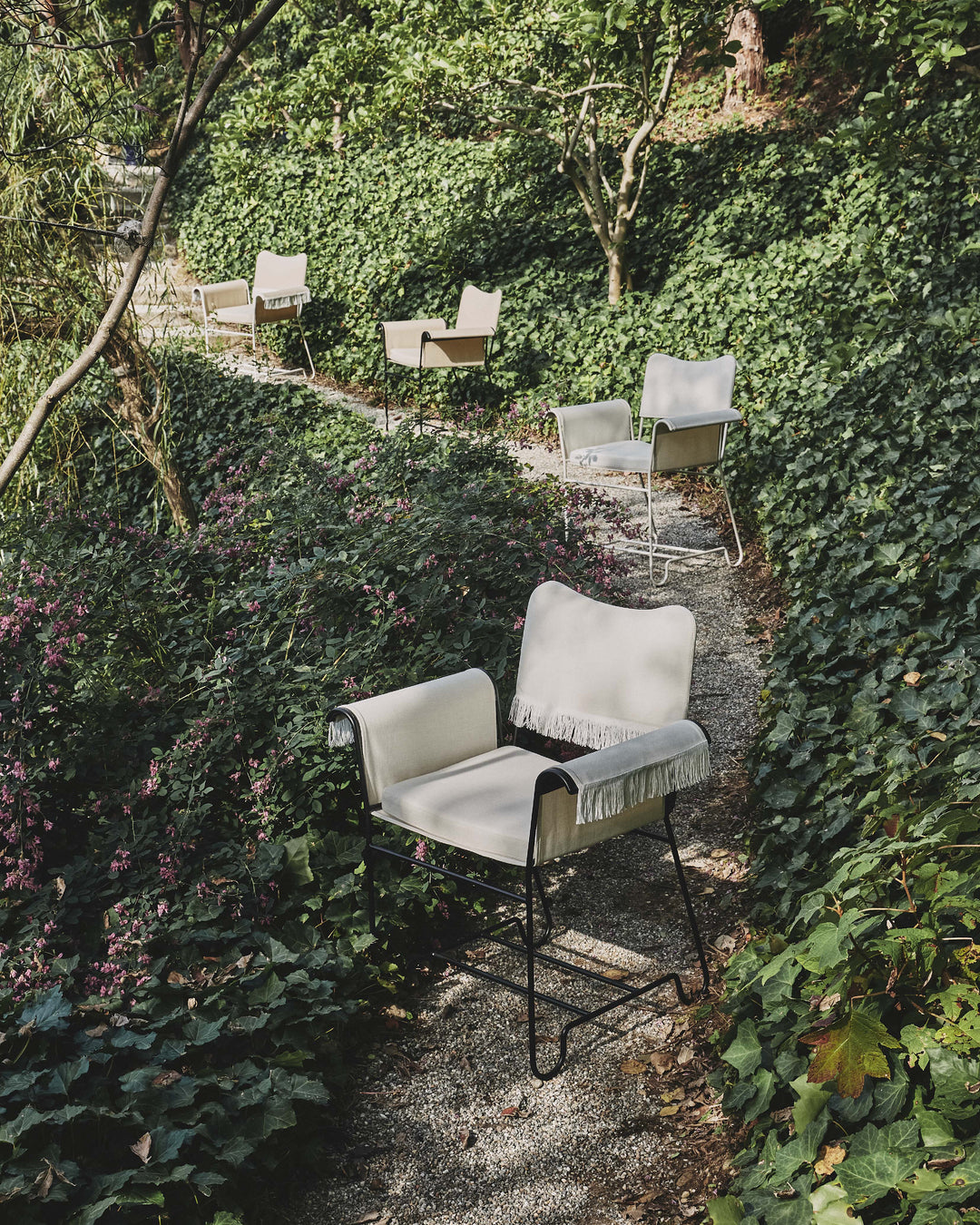 TROPIQUE cream garden chair with a white steel base