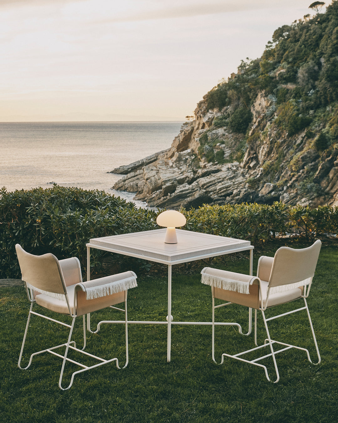 TROPIQUE cream garden chair with a white steel base