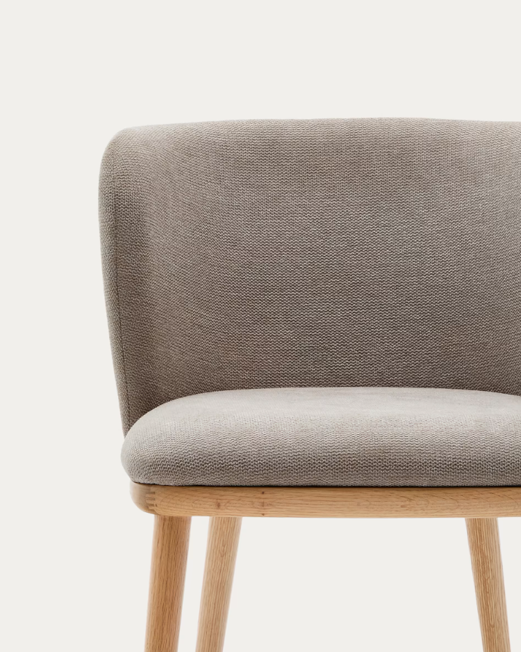 A chair in the ciselia bright brown ciselia fabric with a bright base