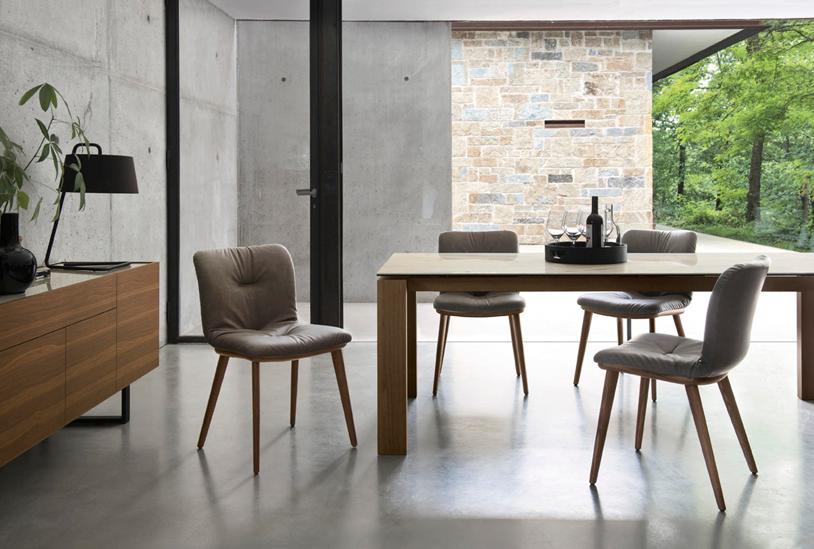 ANNIE SOFT upholstered chair with a dark wooden base