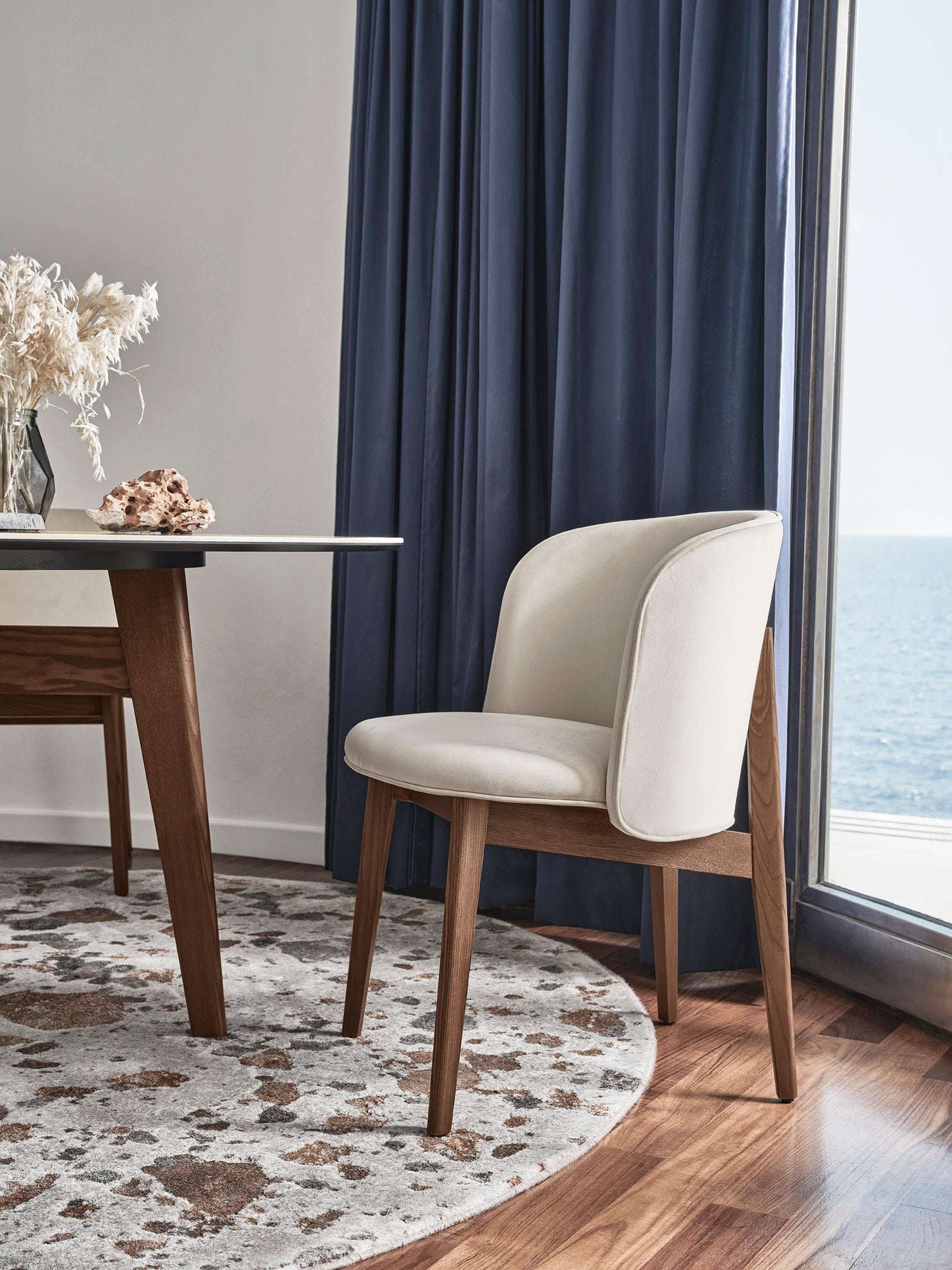 Armchair ABREY upholstered with a dark wooden base