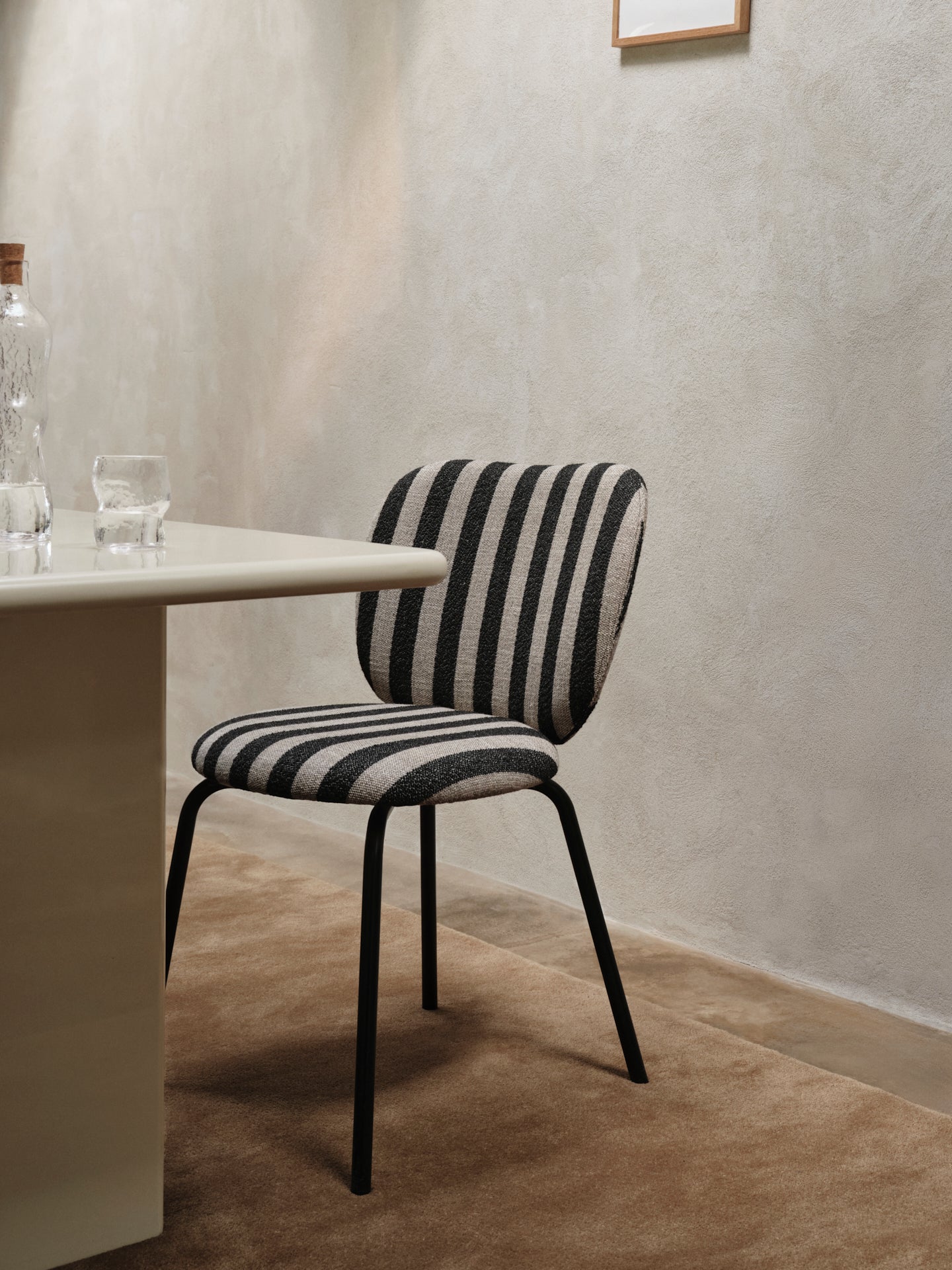 Rico Bouclé chair broken white with a black base