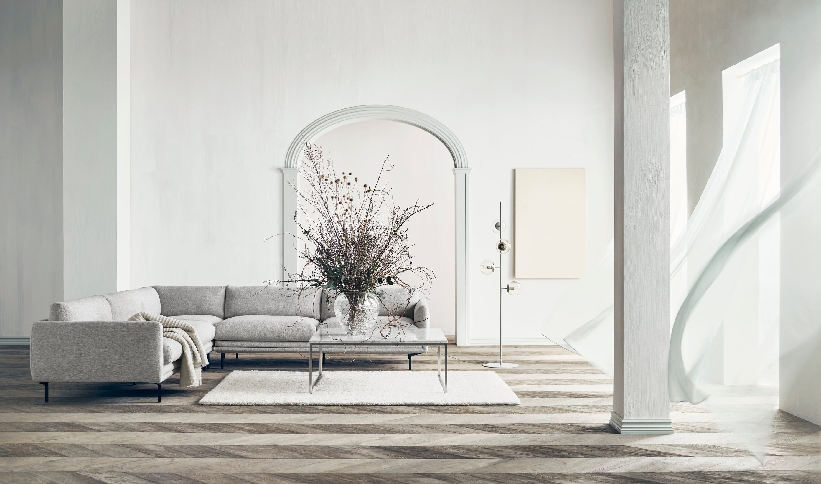 Symetrický rohový gauč LOMI s kovovým podstavcem