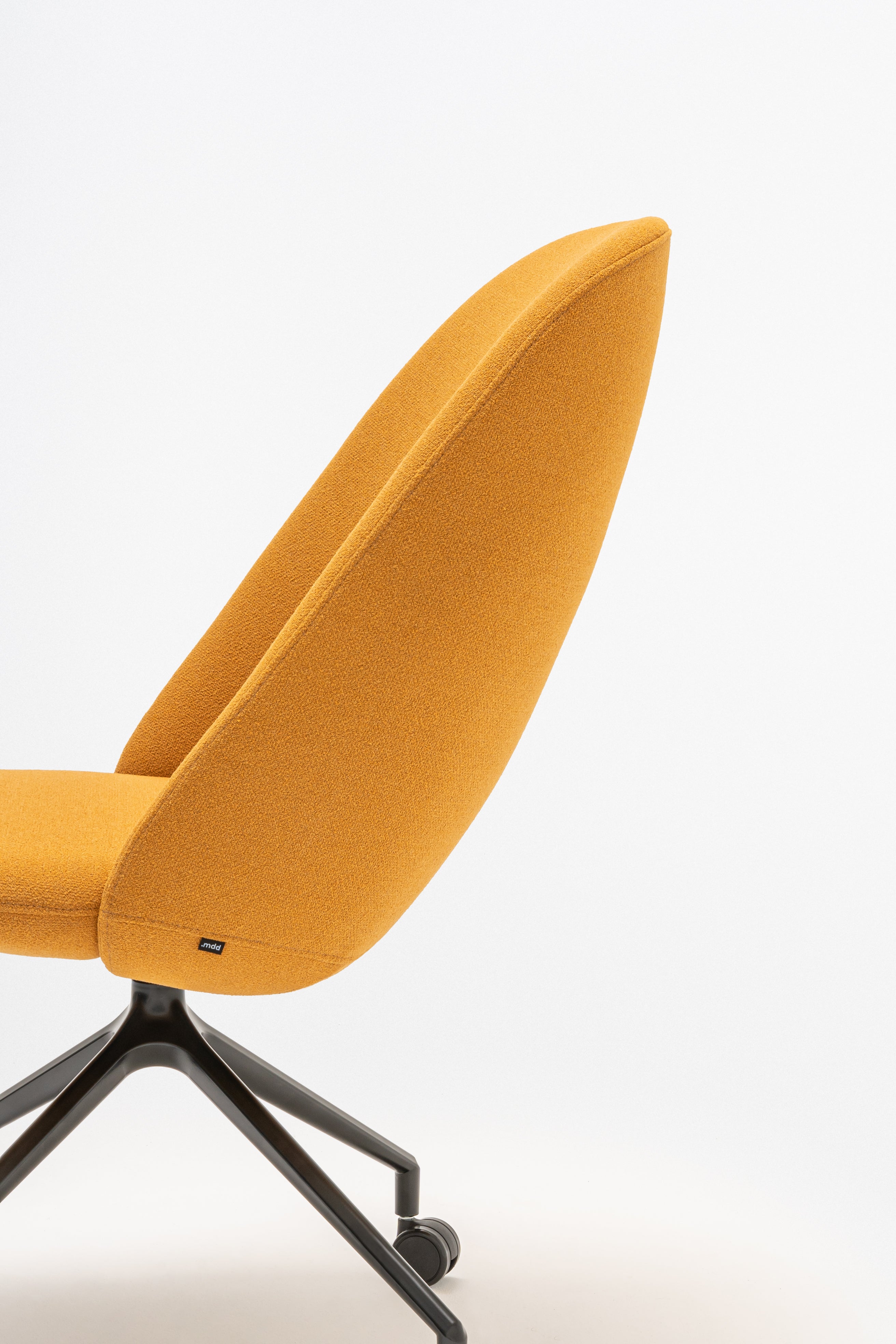 Rotable armchair with a high back parallel metal base with wheels to a hard surface