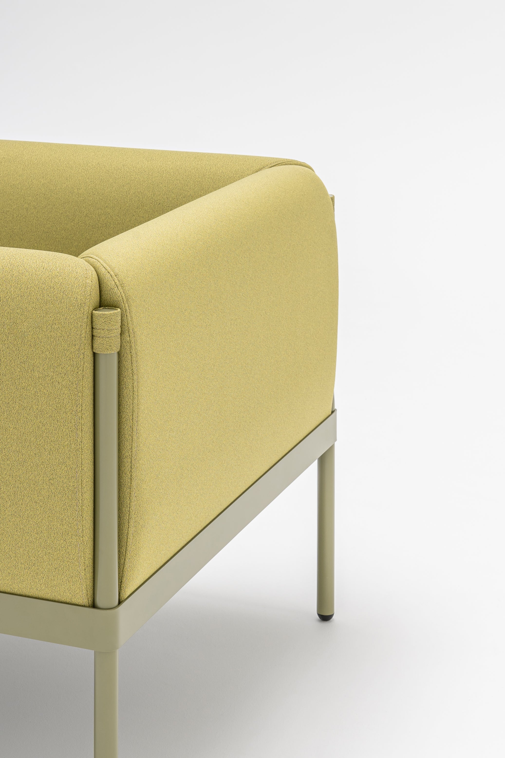 Low upholstered stilt armchair