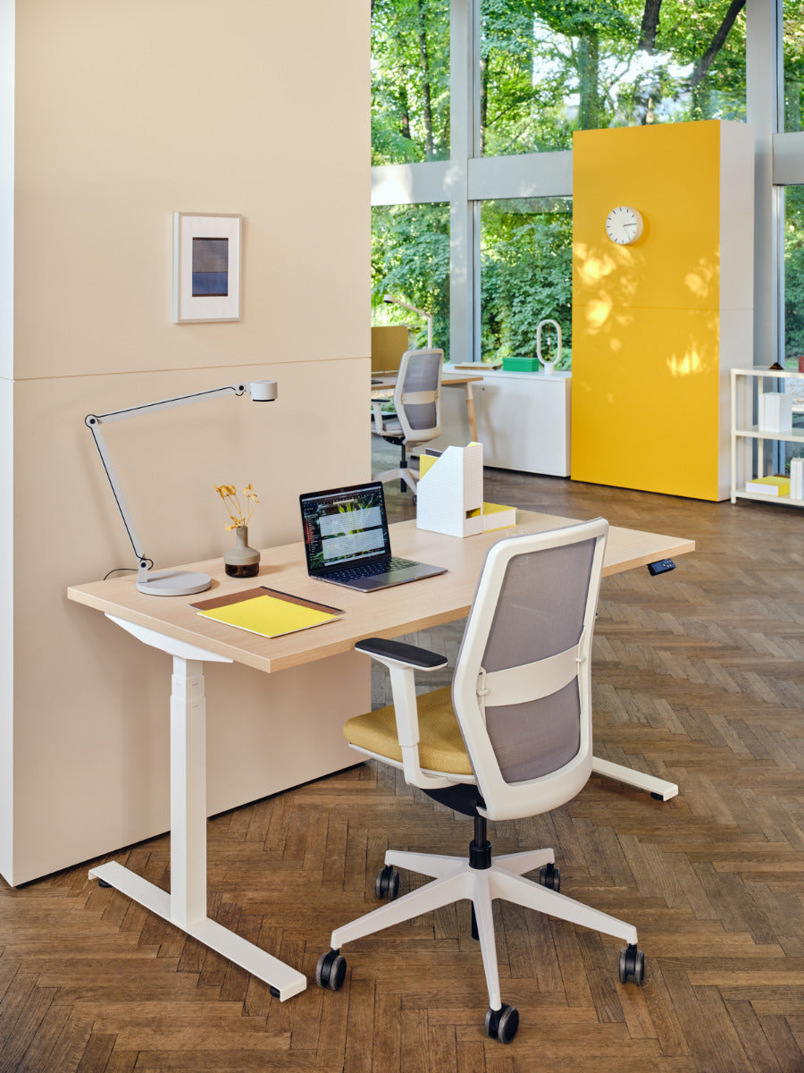 Armchair with an openwork EVO backrest adjustable base with wheels to the hard surface