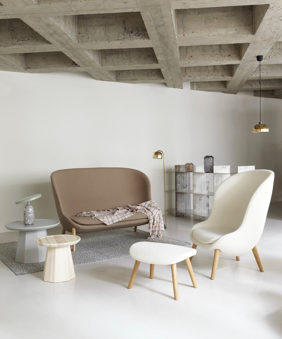 Hyg Upholstered footrest with a black oak base