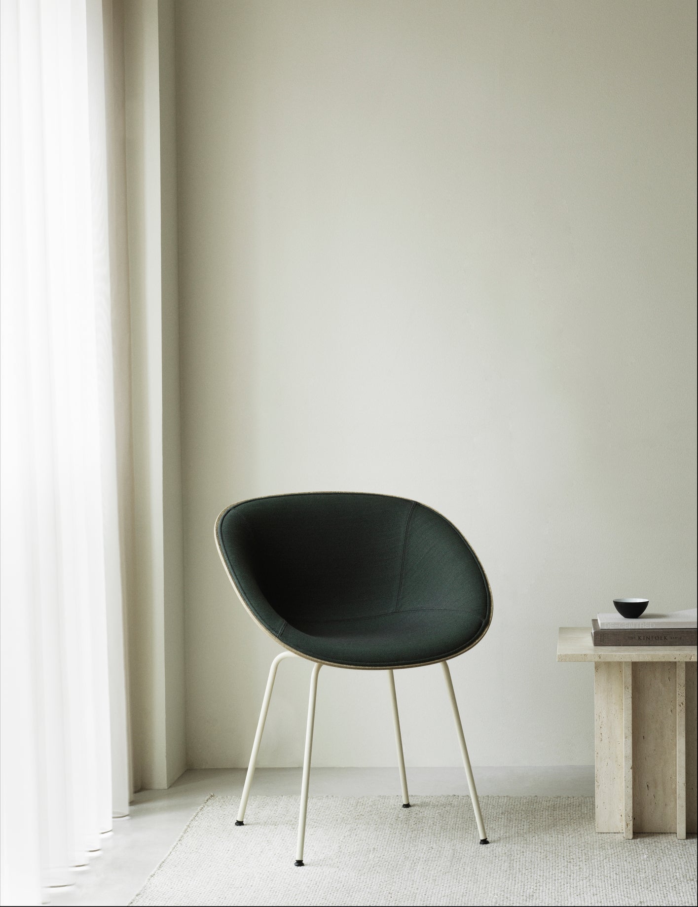 Armchair beige upholstered chair with a cream base