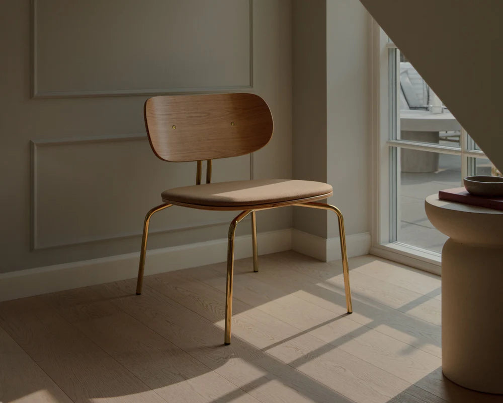 Curious armchair brown plush with a golden base