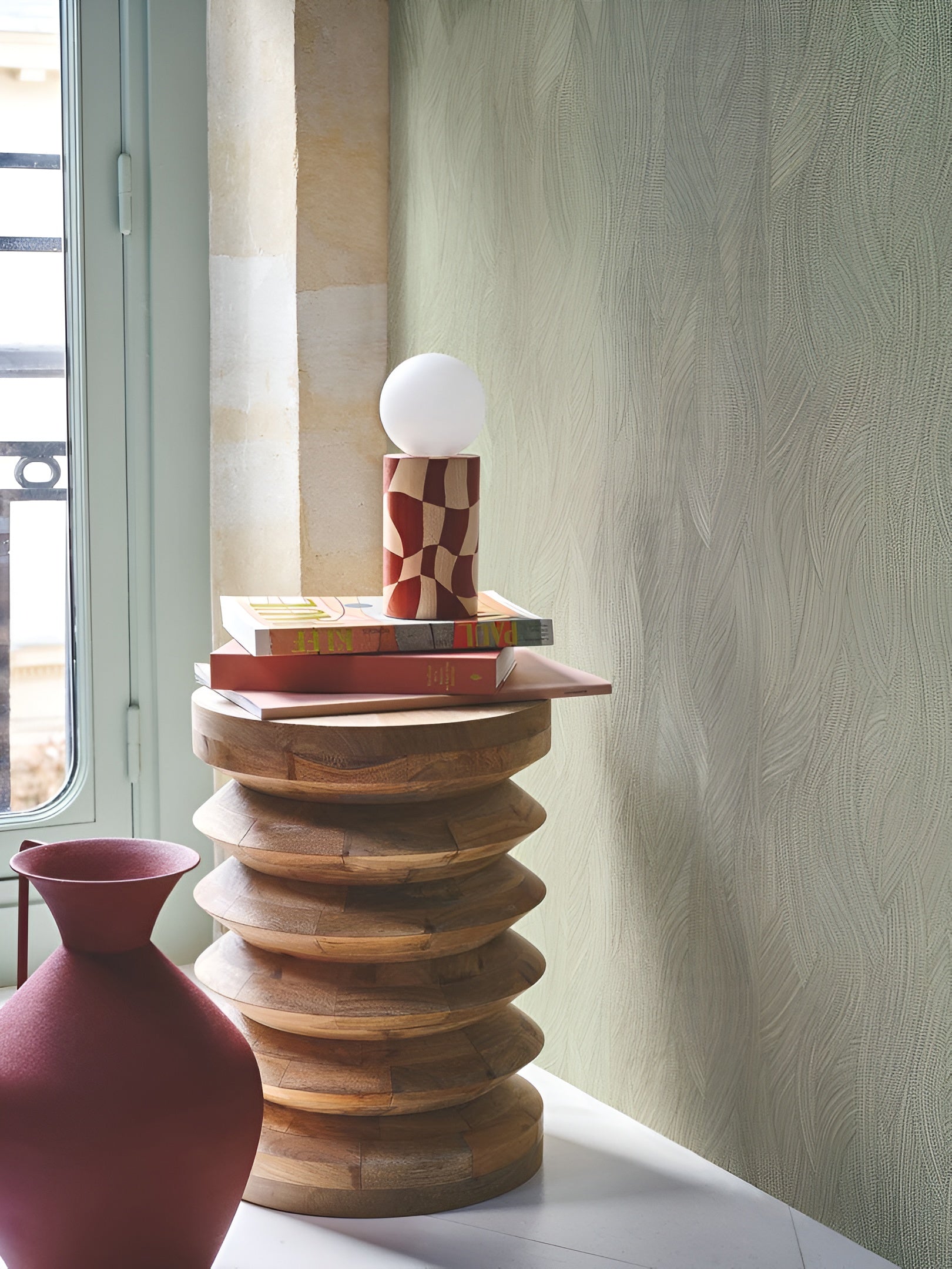 Structural wallpaper with an abstract wavy pattern JASSINE - VERT AMANDE almond green