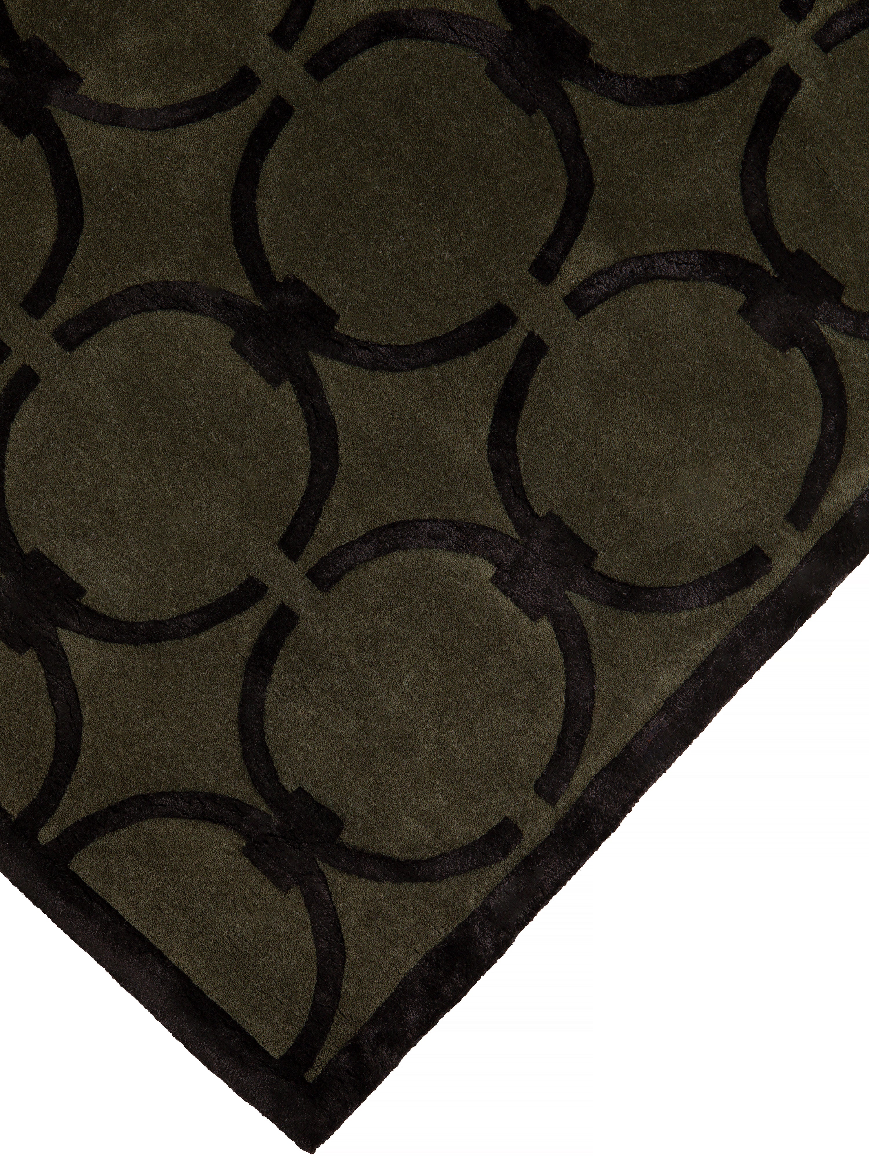 GLAM dark green rug with black geometric pattern