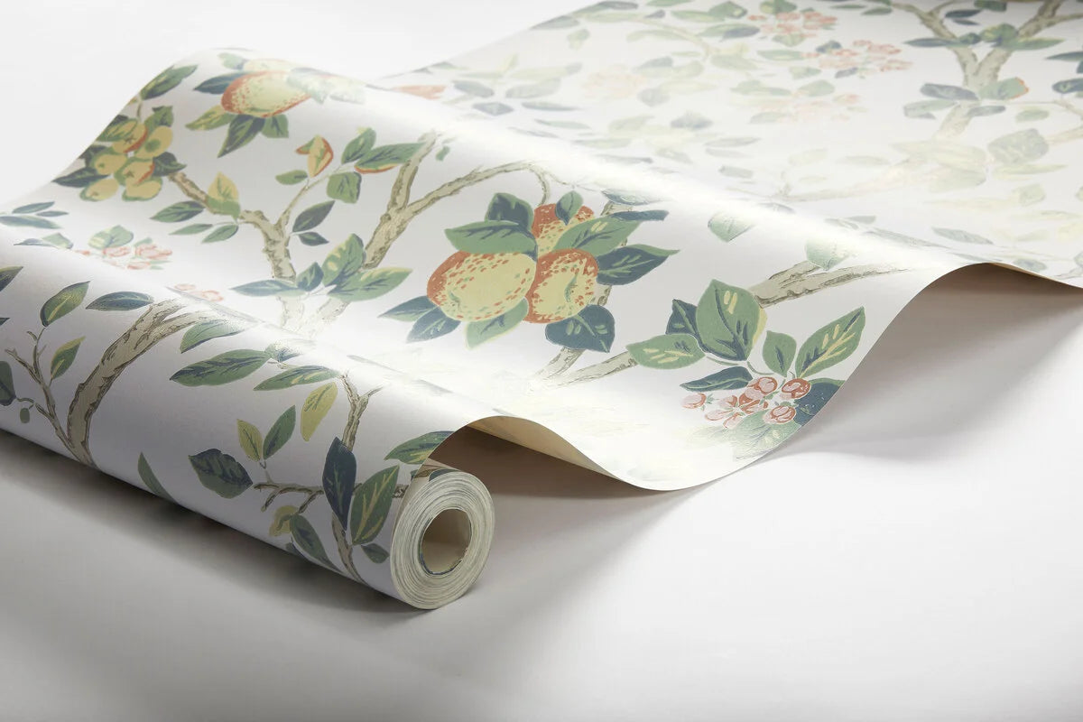 Wallpaper with a botanical pattern of the Ingrid Marie fruit tree in white and green