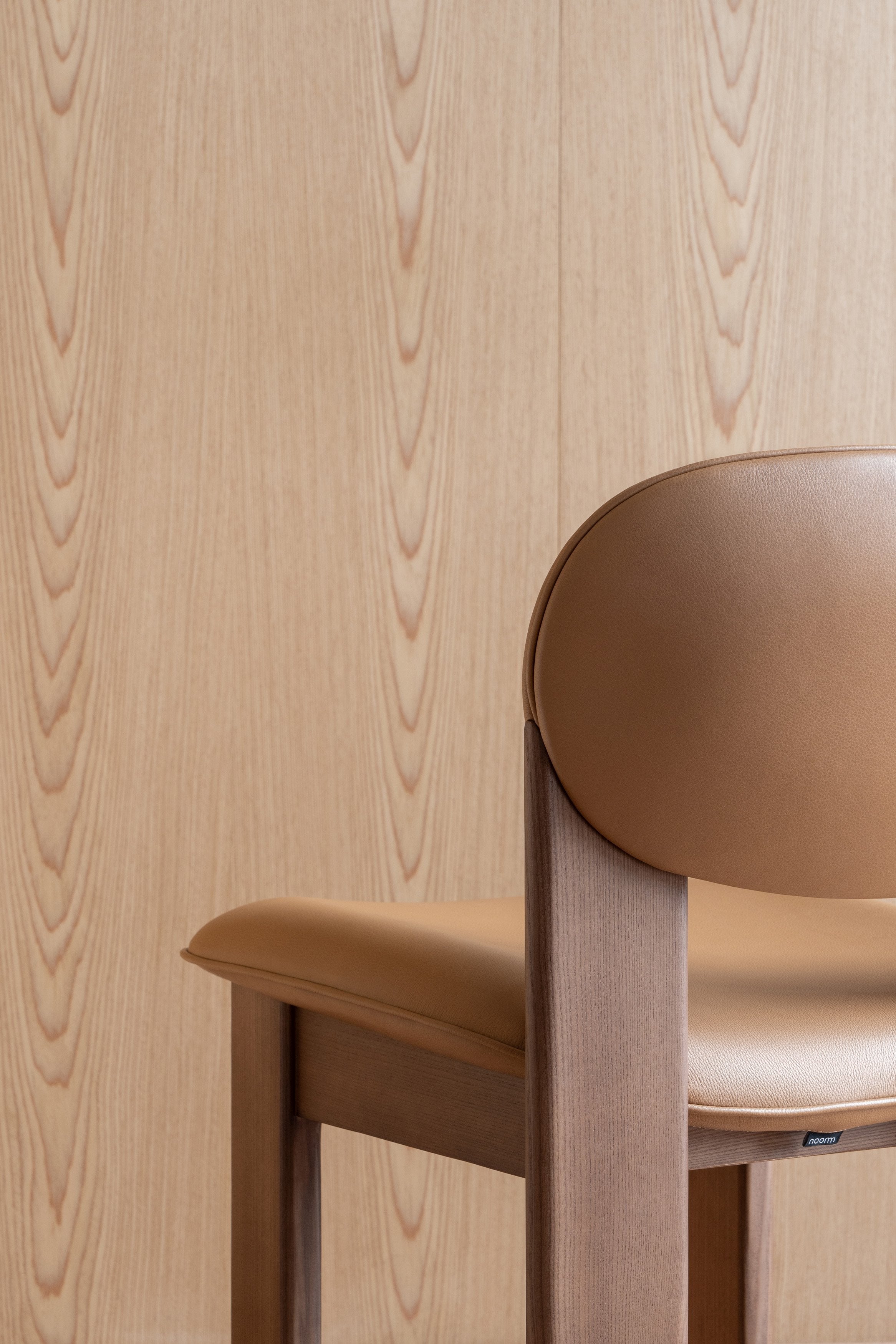 ARCHIPEN upholstered chair with a brown ash base