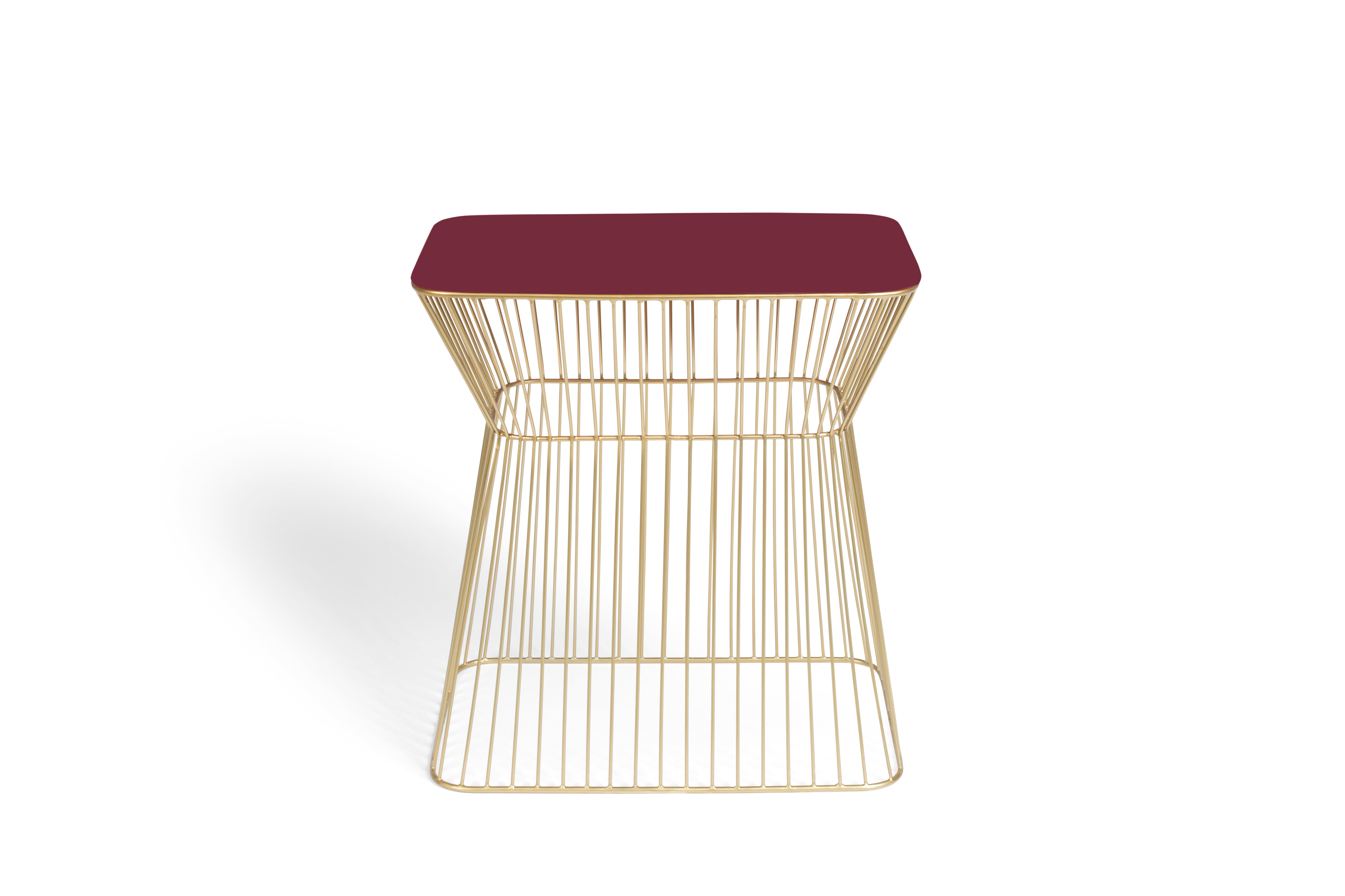 NO OFFENCE side table red wine with a gold base