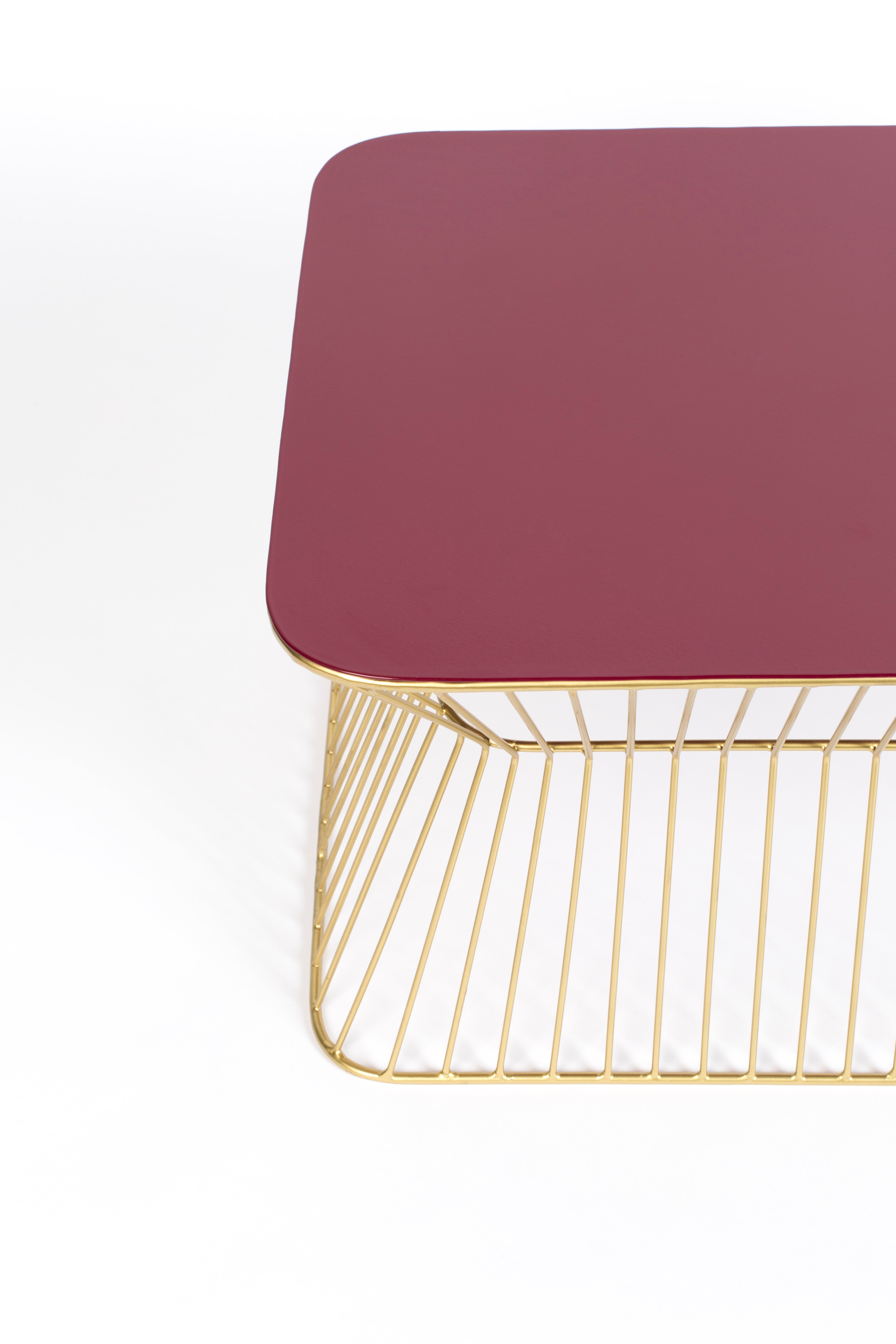 NO OFFENCE wine coffee table with a gold base