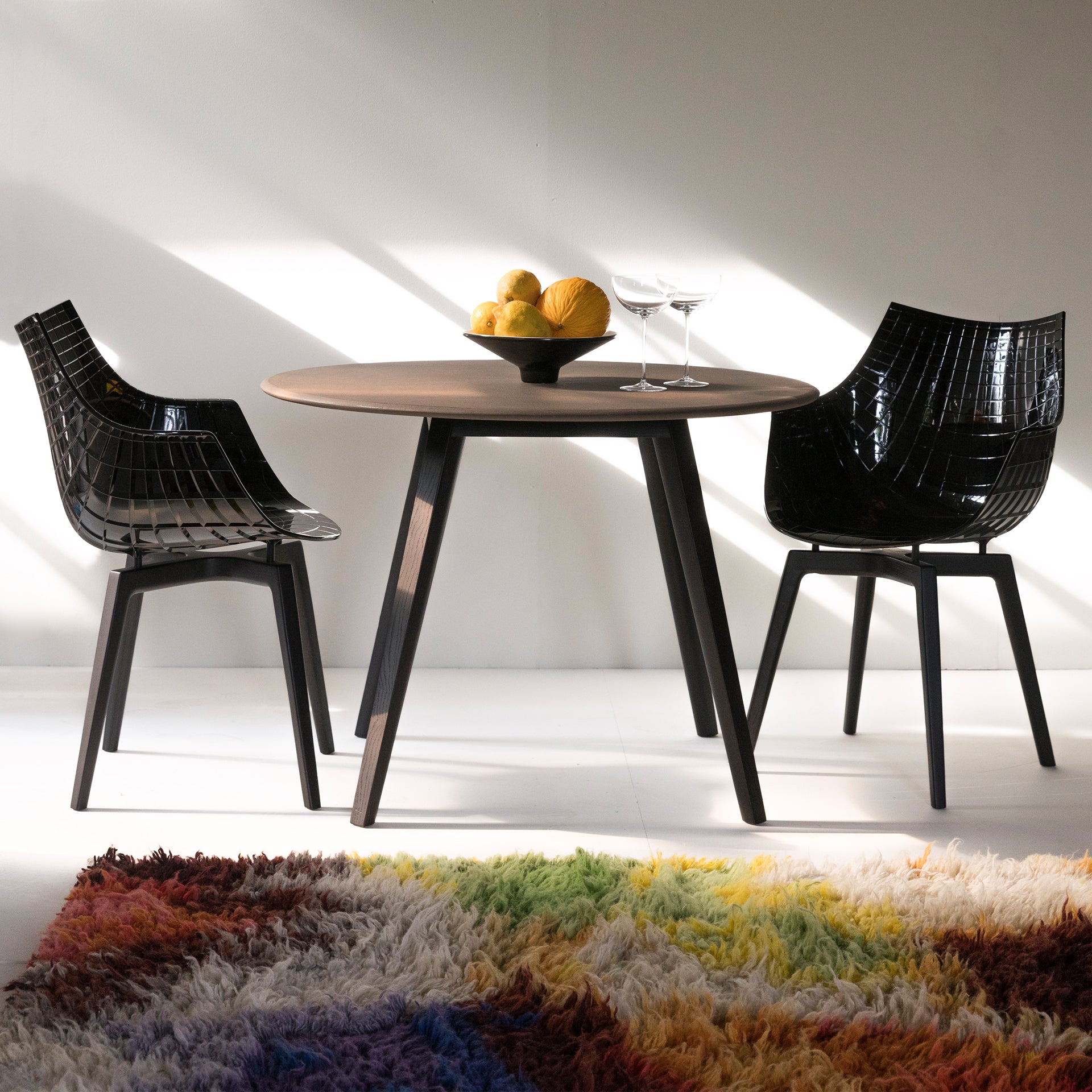 Transparent meridiana chair with a chrome base