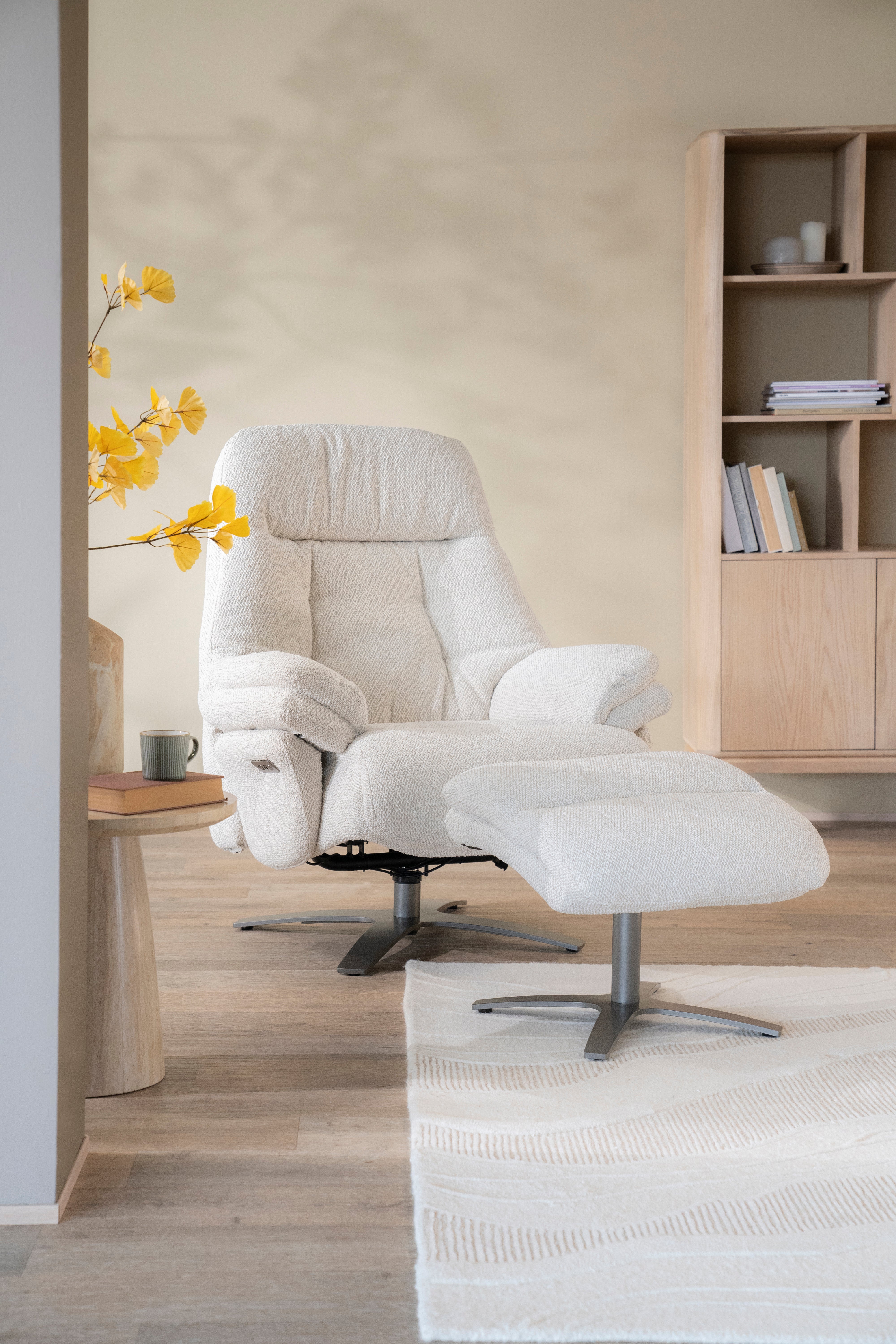 CALEB beige armchair with black base and footrest