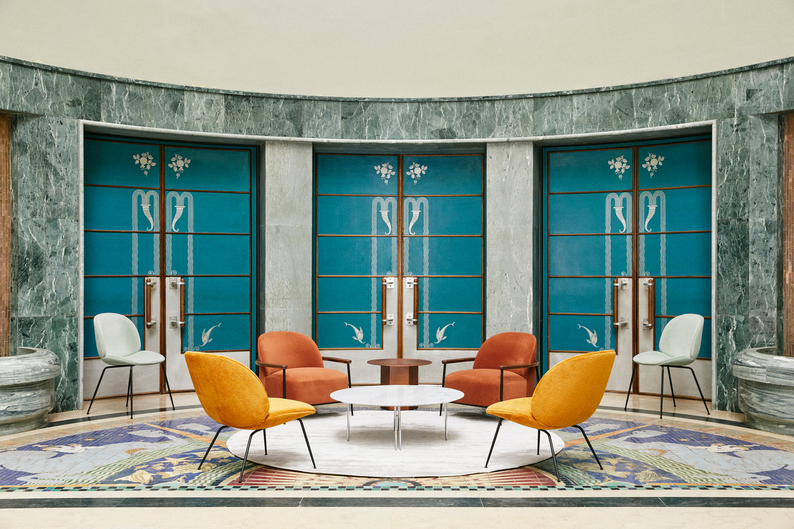 BEETLE armchair upholstered with a gold base