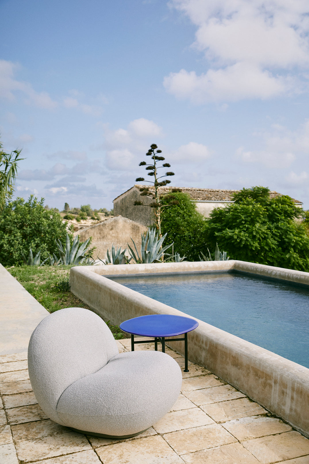 PACHA upholstered outdoor armchair with a gold base