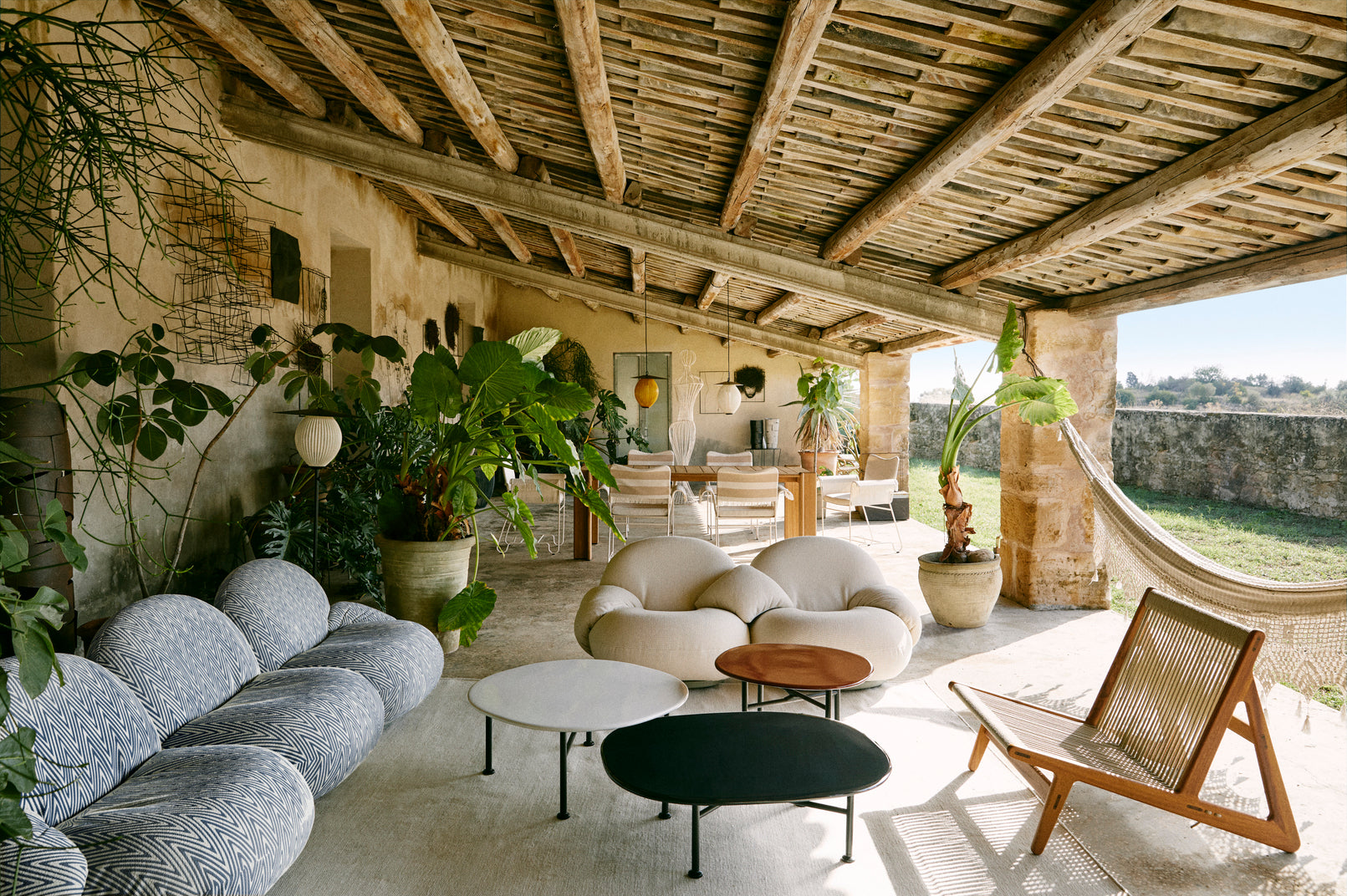 PACHA upholstered outdoor armchair with a gold base