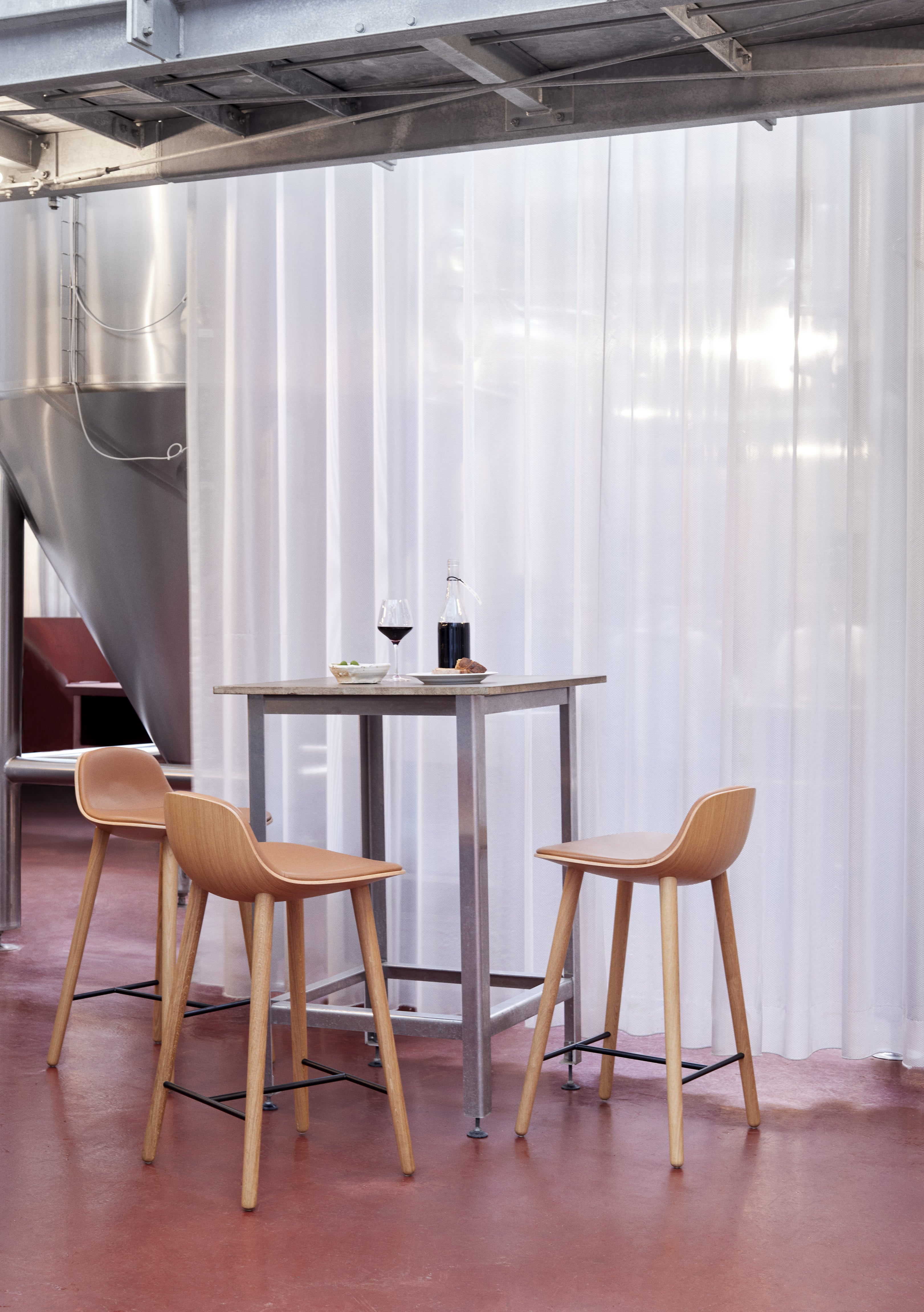 YUUGA stool in brown with a wooden base