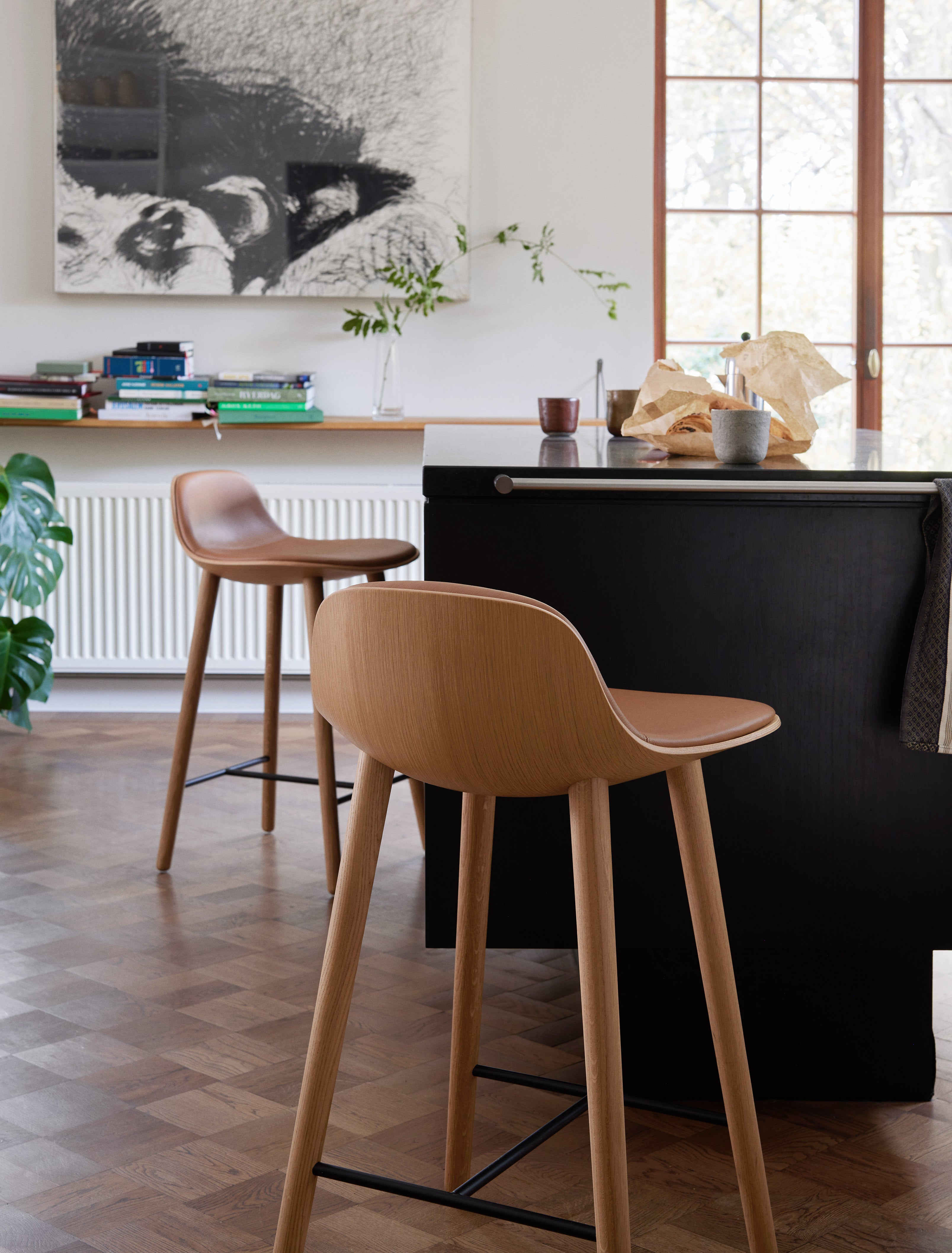 YUUGA stool in brown with a wooden base